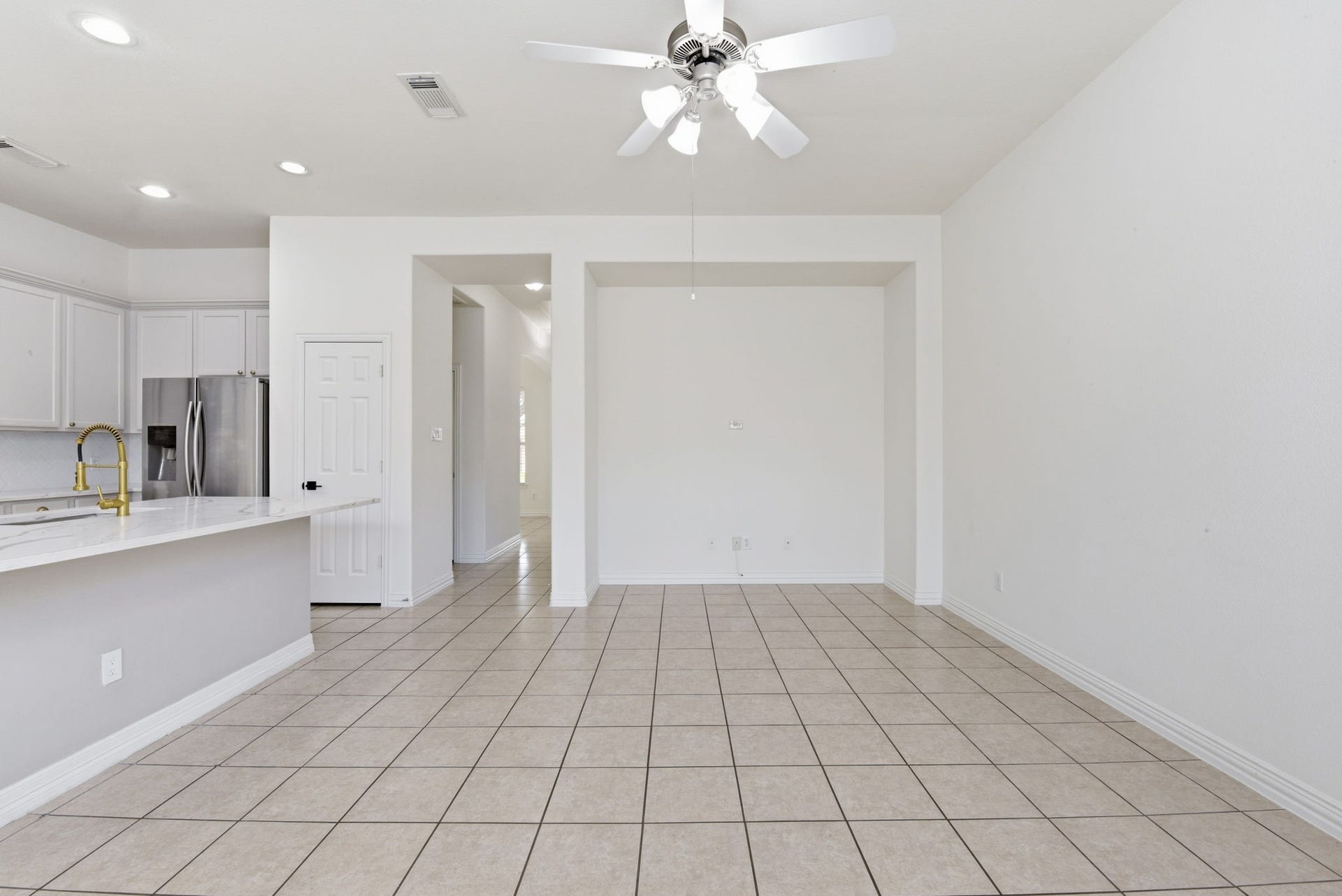 16023 Powder Springs Lane, Houston, TX 77070 Look from living room back toward the entry hallway. Take a peek to your left at that kitchen! Swoon!