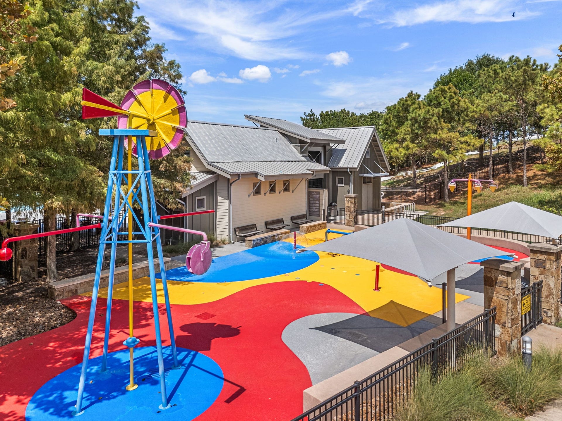 34 Edgemont Court, Fulshear, TX 77441 In Cross Creek Ranch in Fulshear, this colorful splash pad features a windmill-inspired water feature, ground sprays, shaded play areas, and nearby seatingan inviting place for residents to cool off during warm Texas days.