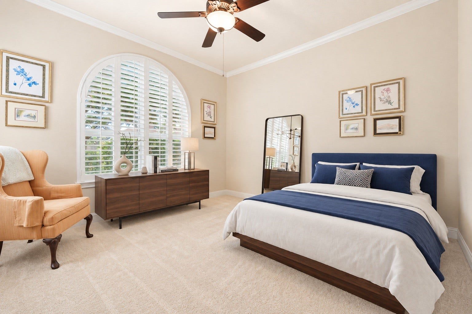 34 Edgemont Court, Fulshear, TX 77441 A secondary bedroom features an arched window with shutters, adding architectural charm and natural light. Virtually staged.