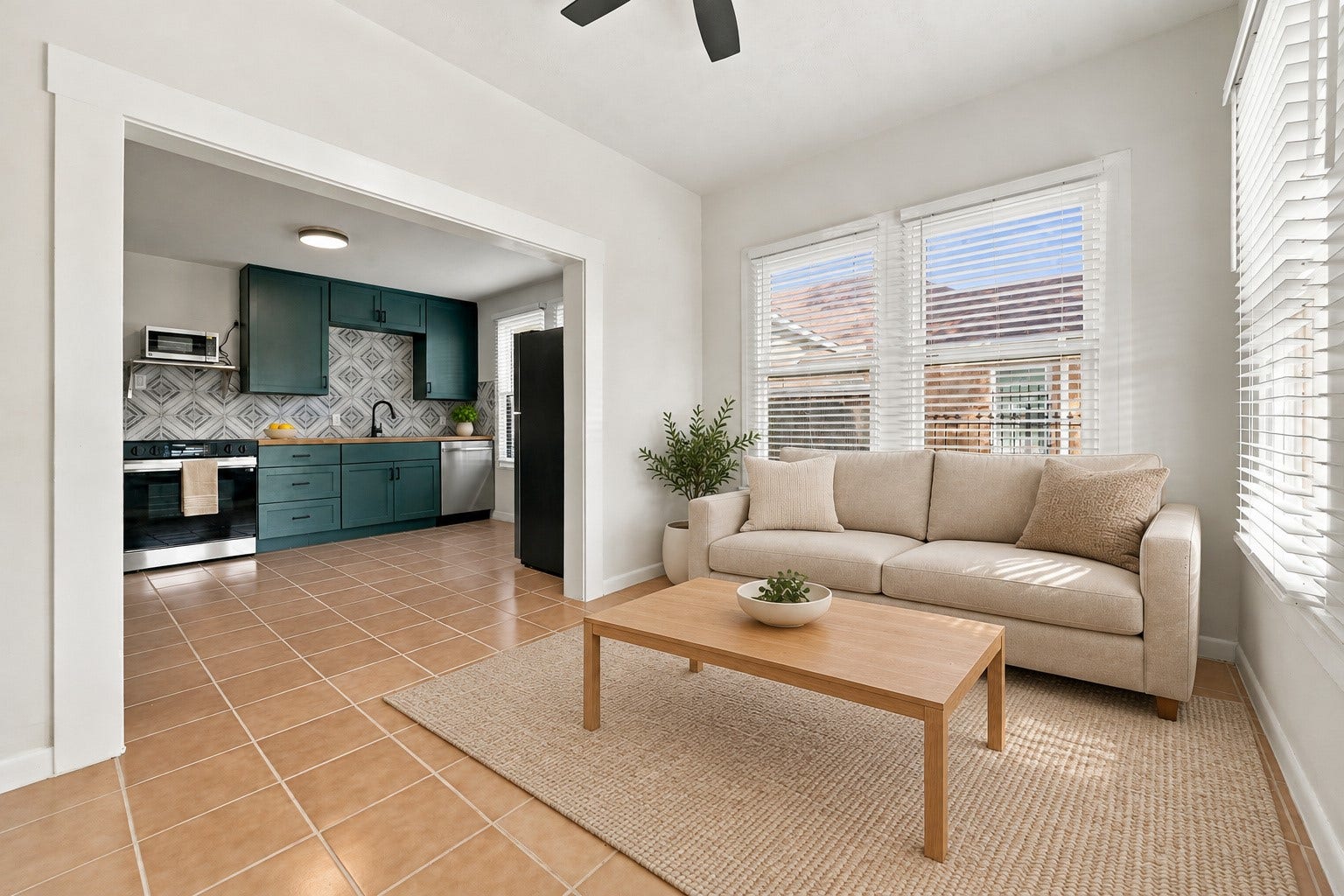 5129 Claremont Street, Houston, TX 77023 Unit 2: Living room with access to kitchen. Virtually staged.