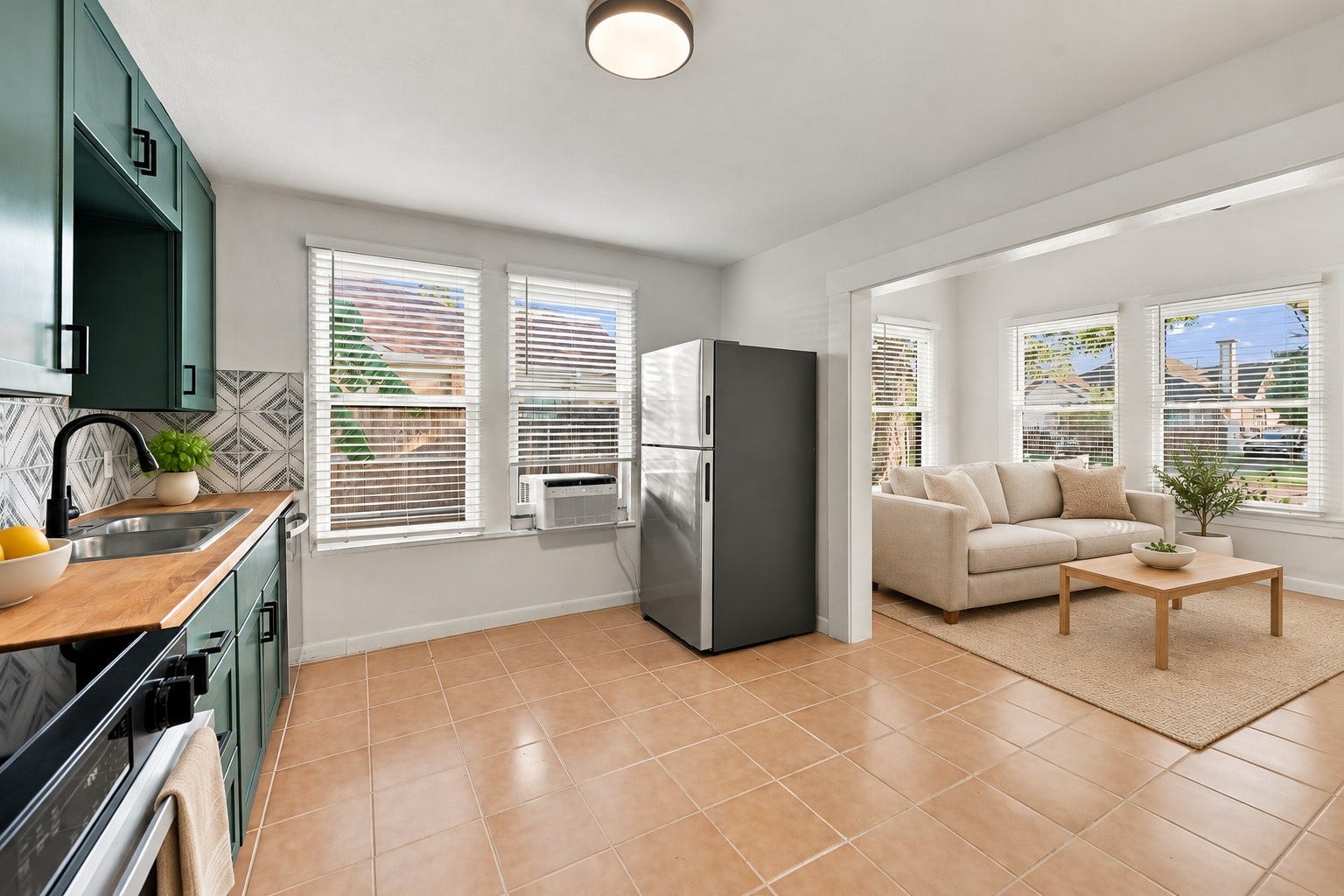 5129 Claremont Street, Houston, TX 77023 Unit 2: Kitchen and living room. Virtually staged.