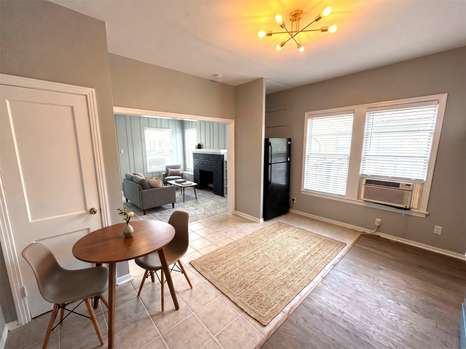 5129 Claremont Street, Houston, TX 77023 Unit 1 kitchen and living room view with virtual staging. New oak flooring.
