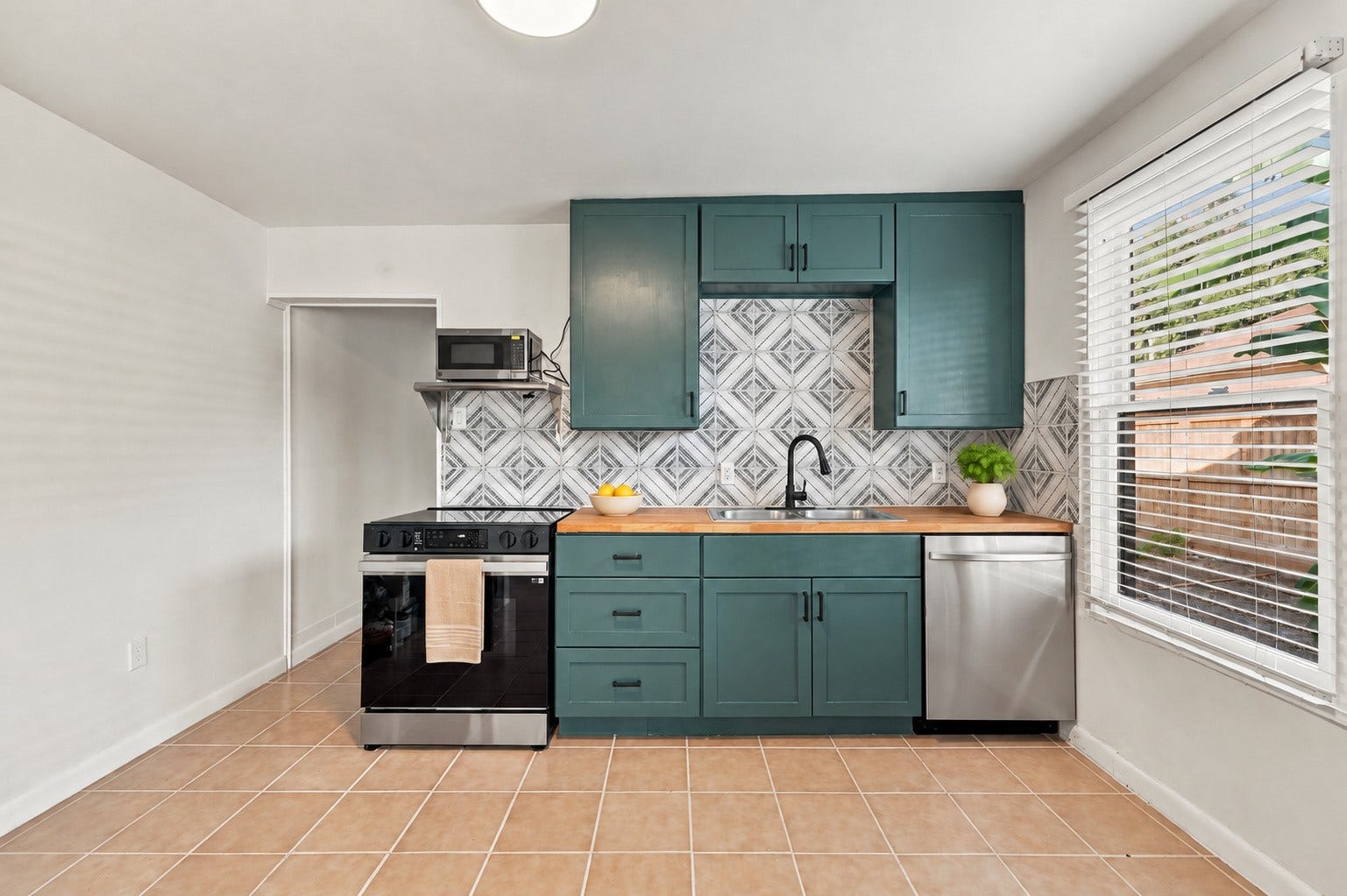 5129 Claremont Street, Houston, TX 77023 Unit 2: New cabinets, butcher block countertops, new appliances.