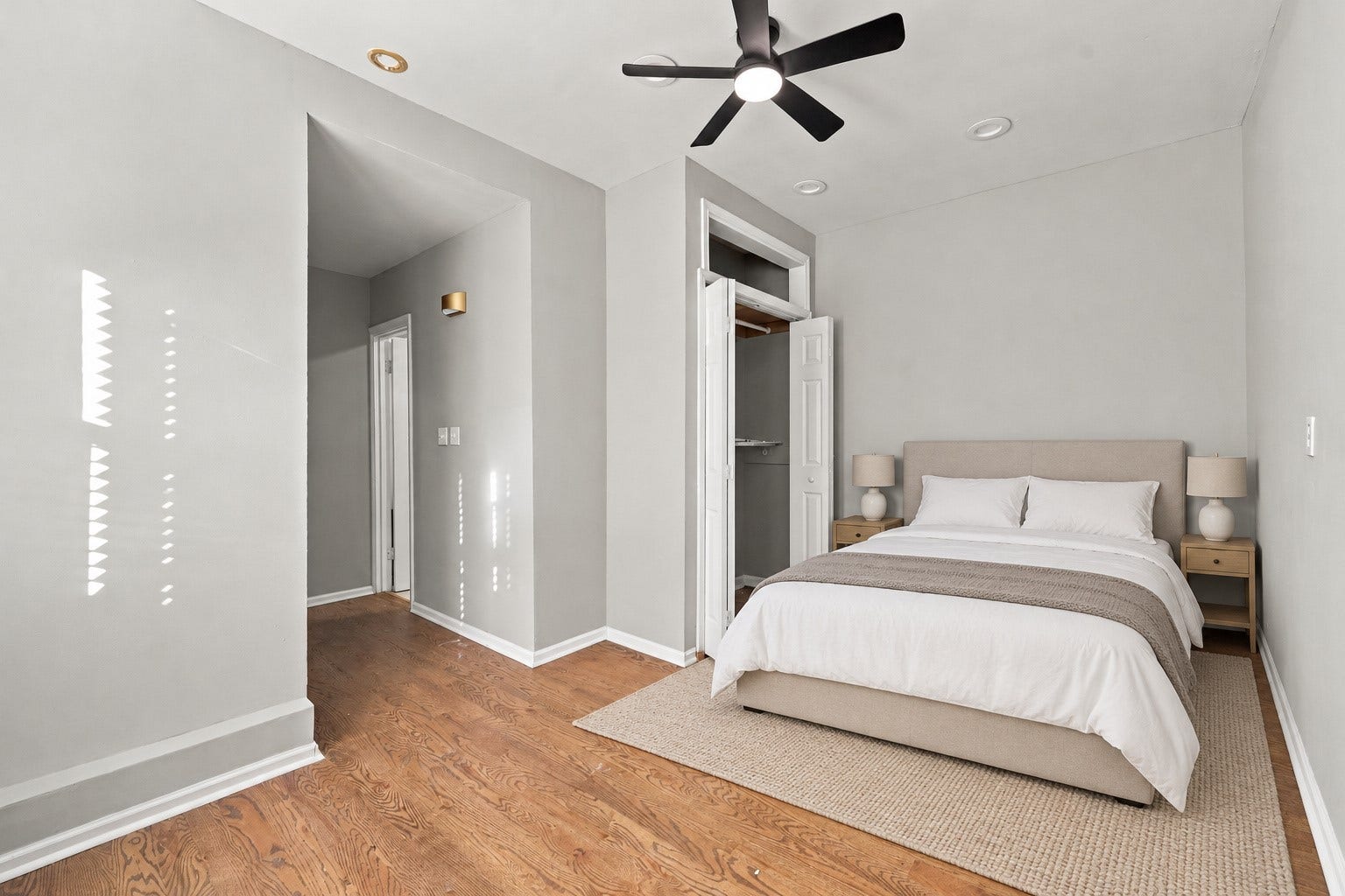 5129 Claremont Street, Houston, TX 77023 Unit 1: Bedroom with access to the bathroom and back access to backyard. Virtually staged.