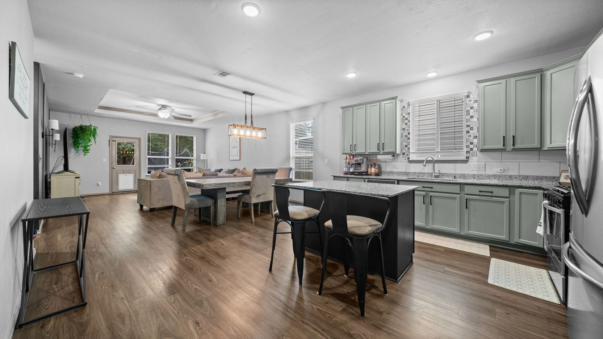 4170 Hidden Timbers Lane, Conroe, TX 77304 Enjoy the best of open-concept living! The kitchen, dining, and living areas connect beautifully, creating an inviting space for everyday comfort.