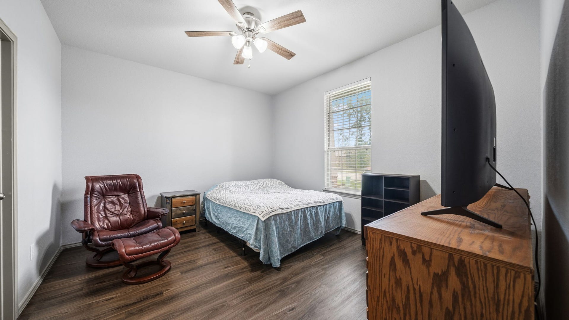4170 Hidden Timbers Lane, Conroe, TX 77304 A rare find! This second primary bedroom near the front of the home offers a ceiling fan, walk-in closet, and plenty of room to make it your own.