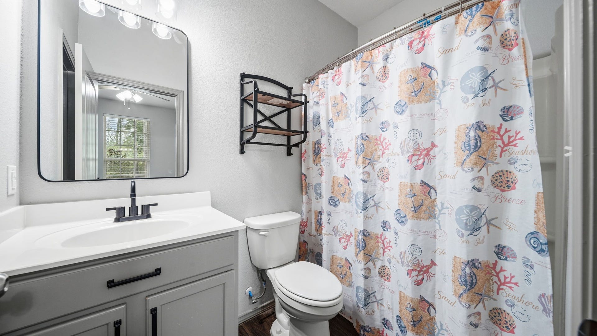 4170 Hidden Timbers Lane, Conroe, TX 77304 Enjoy the convenience of a private bathroom adjoining the second primary bedroom, complete with a modern vanity and tub/shower combination.