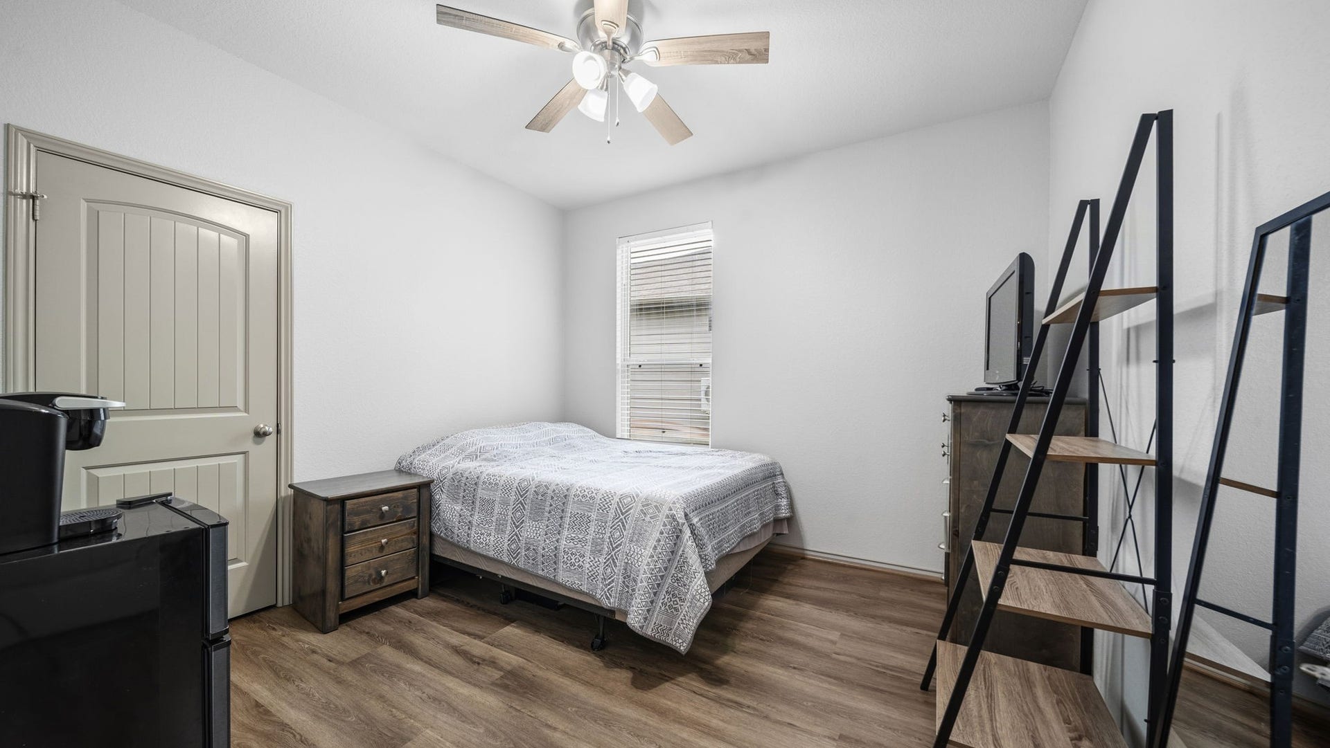 4170 Hidden Timbers Lane, Conroe, TX 77304 Another inviting bedroom with a ceiling fan, attractive flooring, and flexible space for your personal needs.