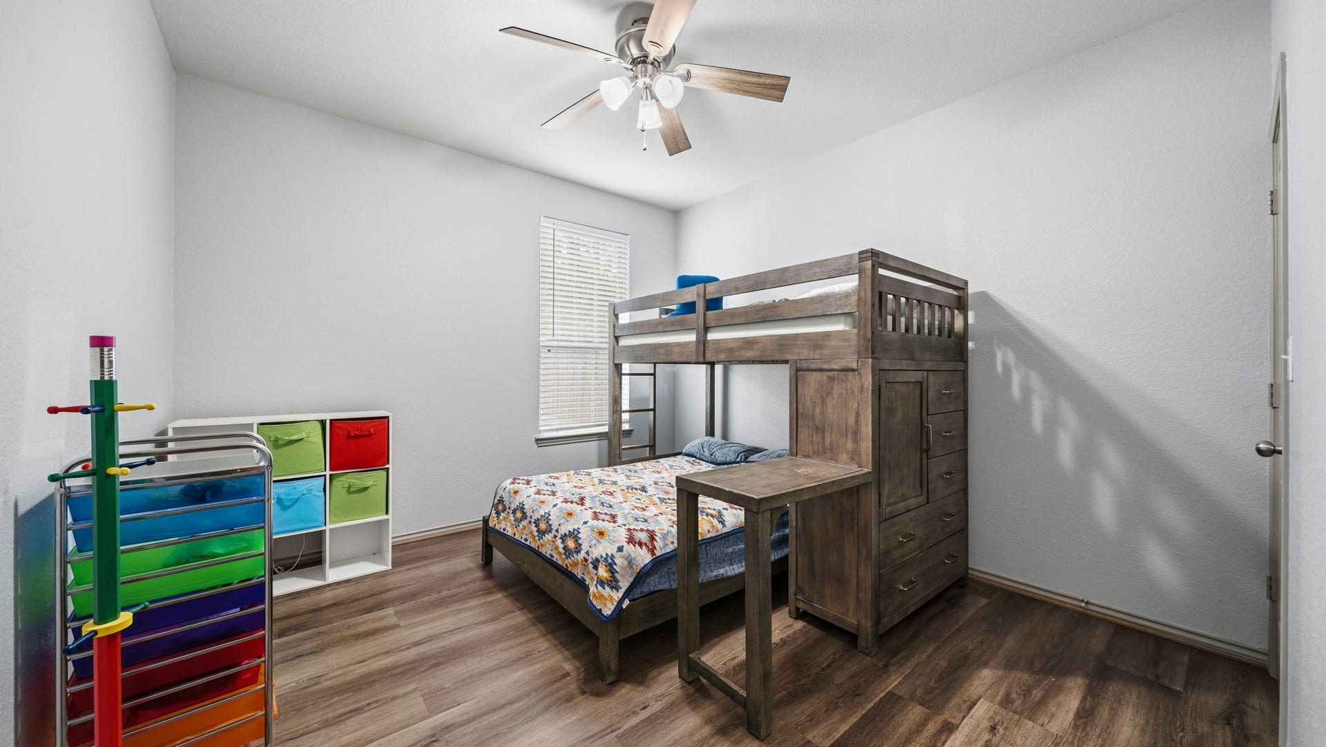 4170 Hidden Timbers Lane, Conroe, TX 77304 Bright and comfortable bedroom featuring a ceiling fan, natural light, and beautiful flooringno carpet to worry about!