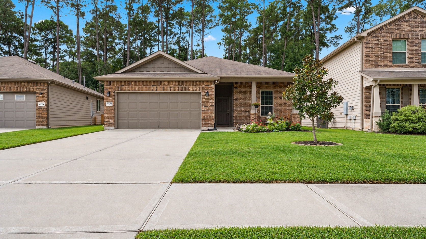 4170 Hidden Timbers Lane, Conroe, TX 77304 Welcome home! This charming single-story brick home offers beautiful curb appeal, a manicured lawn, and a spacious 2-car garage.