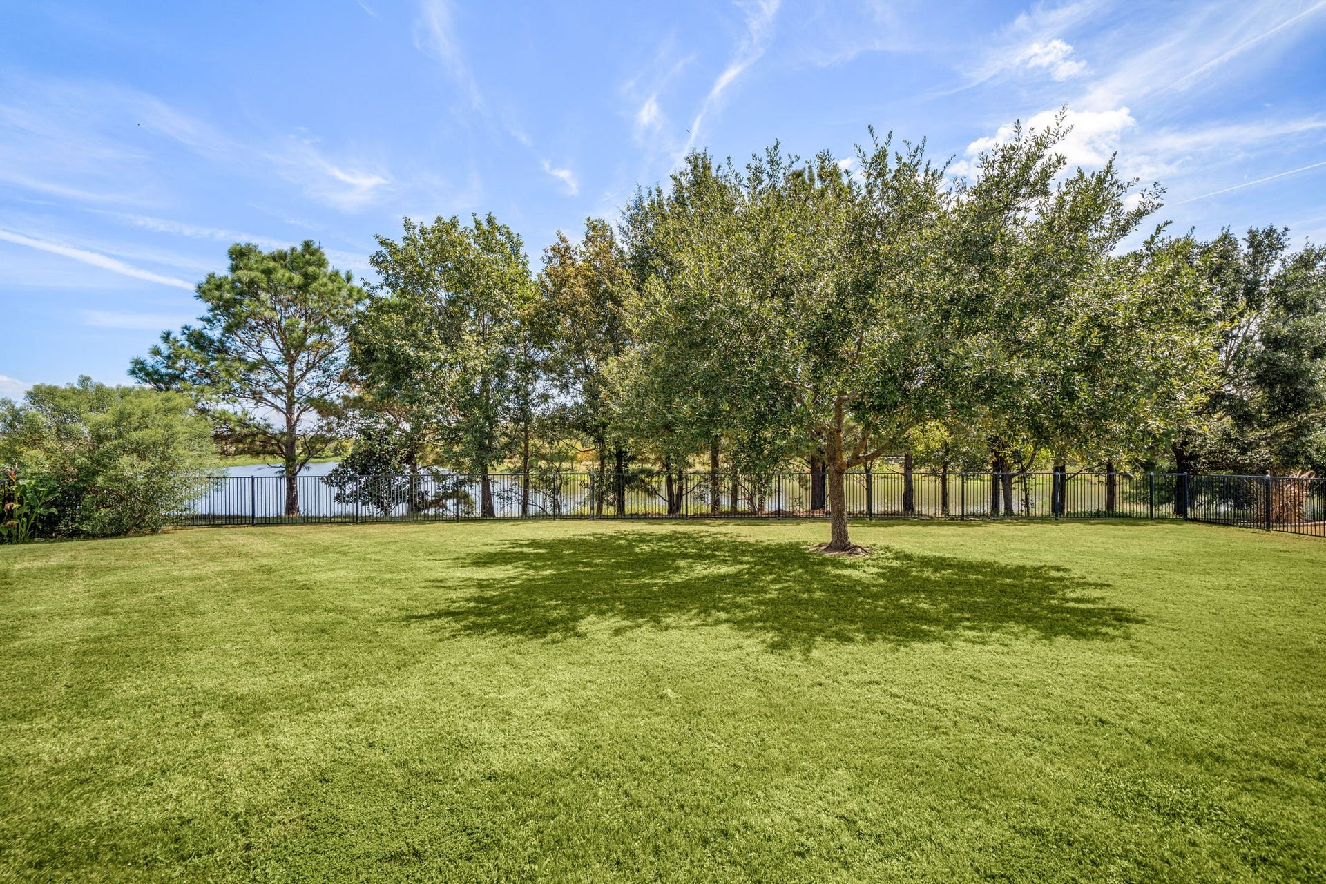 34 Edgemont Court, Fulshear, TX 77441 The generous lot leaves space for a pool, garden, or play area, all within the privacy of a fully fenced yard.