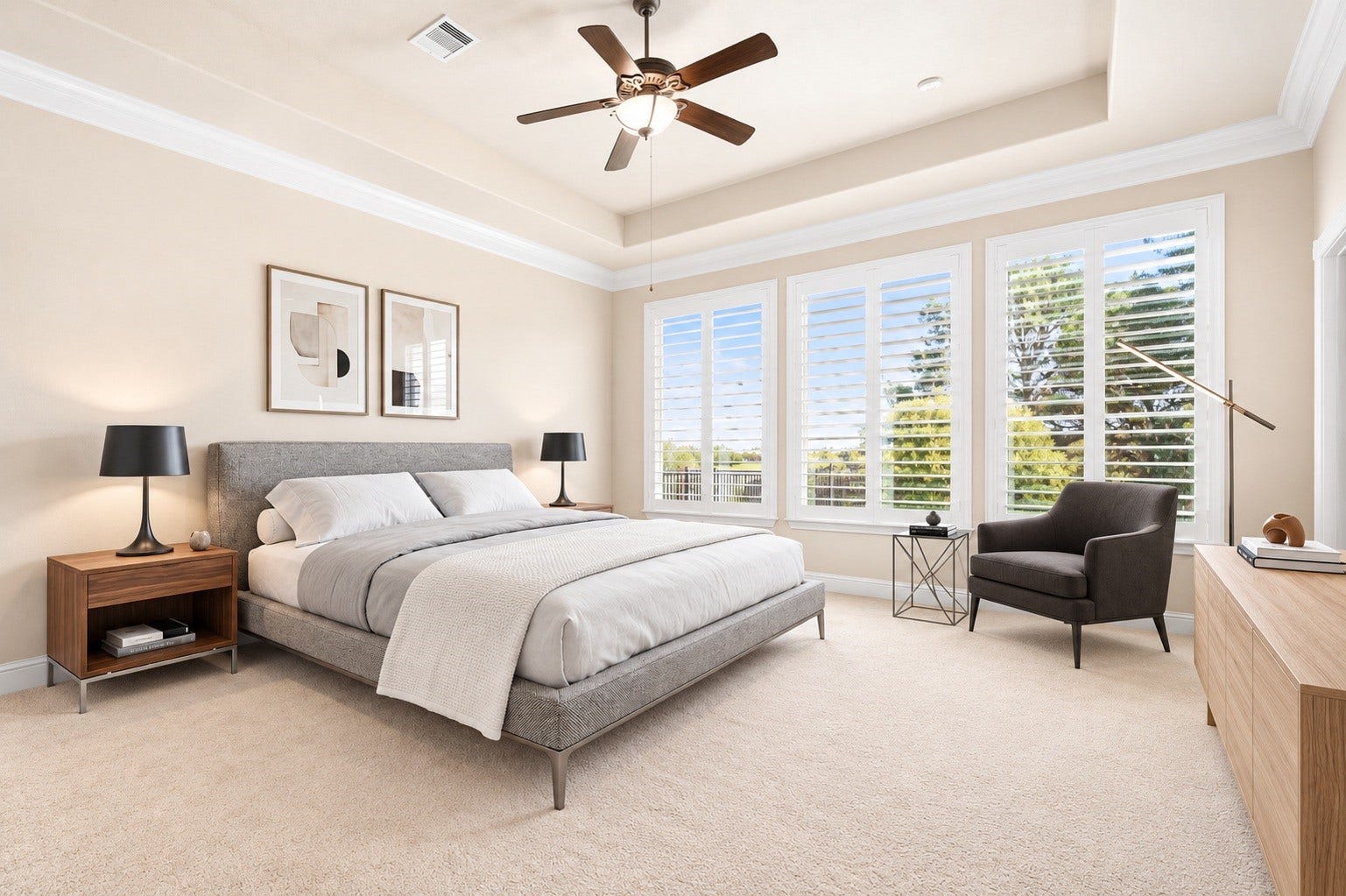 34 Edgemont Court, Fulshear, TX 77441 The primary suite offers a peaceful retreat, framed by a tray ceiling and a wall of windows overlooking the backyard. Virtually staged.