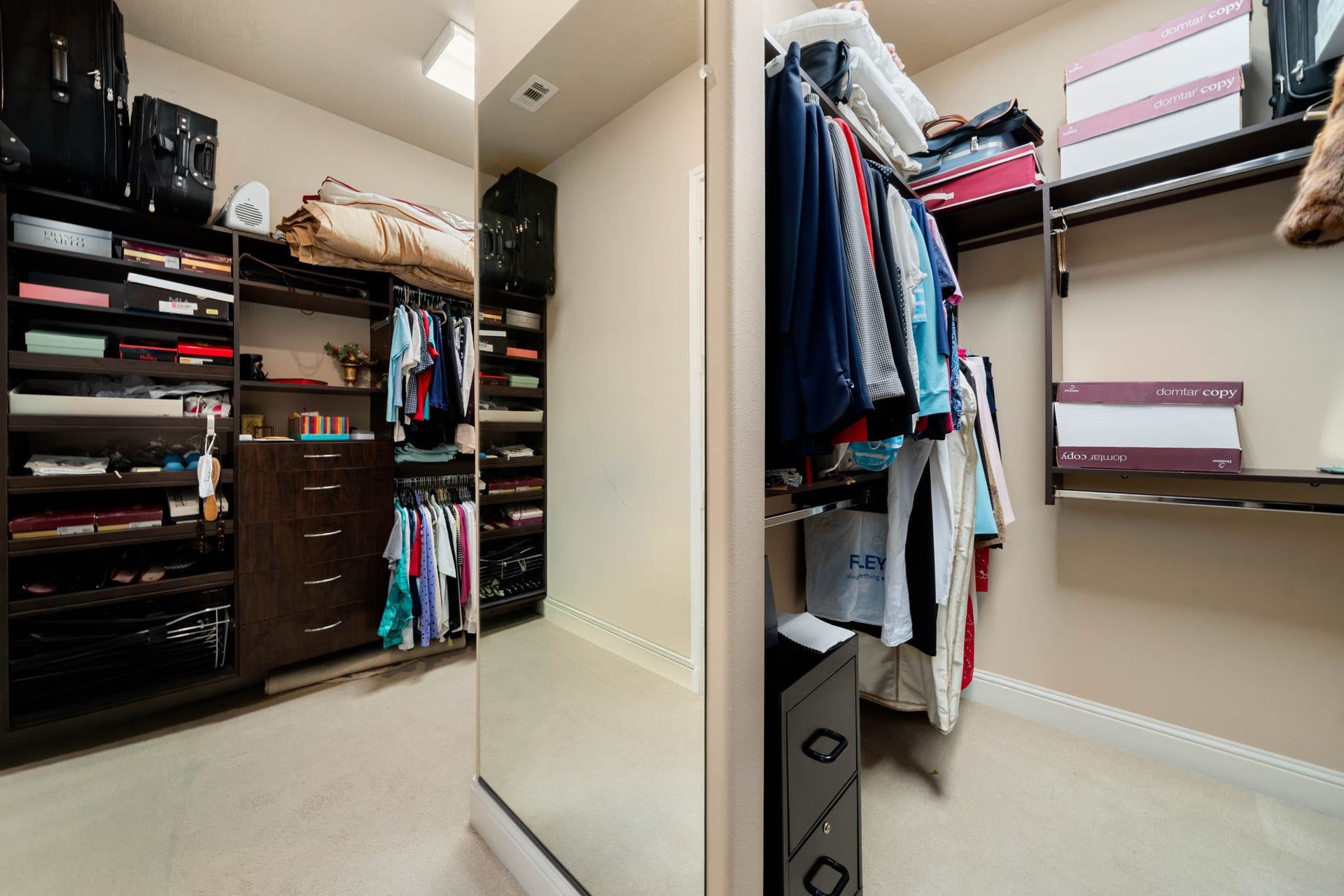 34 Edgemont Court, Fulshear, TX 77441 The primary closet offers generous built-in shelving and hanging space for effortless organization.