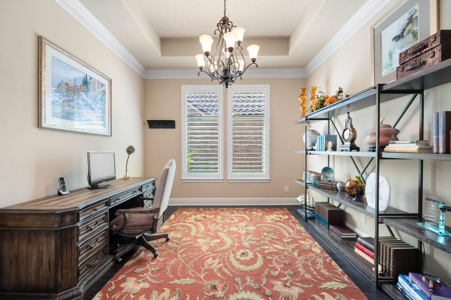 34 Edgemont Court, Fulshear, TX 77441 A private home office offers a quiet retreat, complete with a tray ceiling and custom built-in shelving.