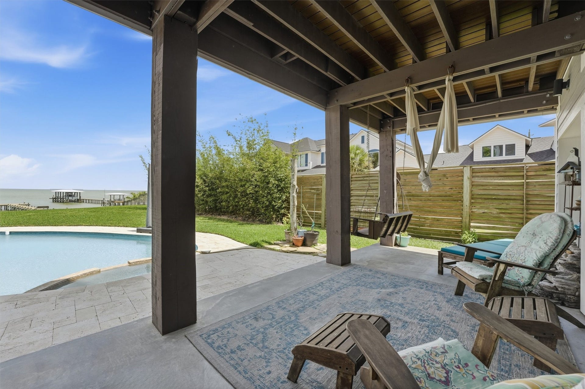 4019 Bayshore Drive Drive, Bacliff, TX 77518 Watch the fun in the pool in this sitting area