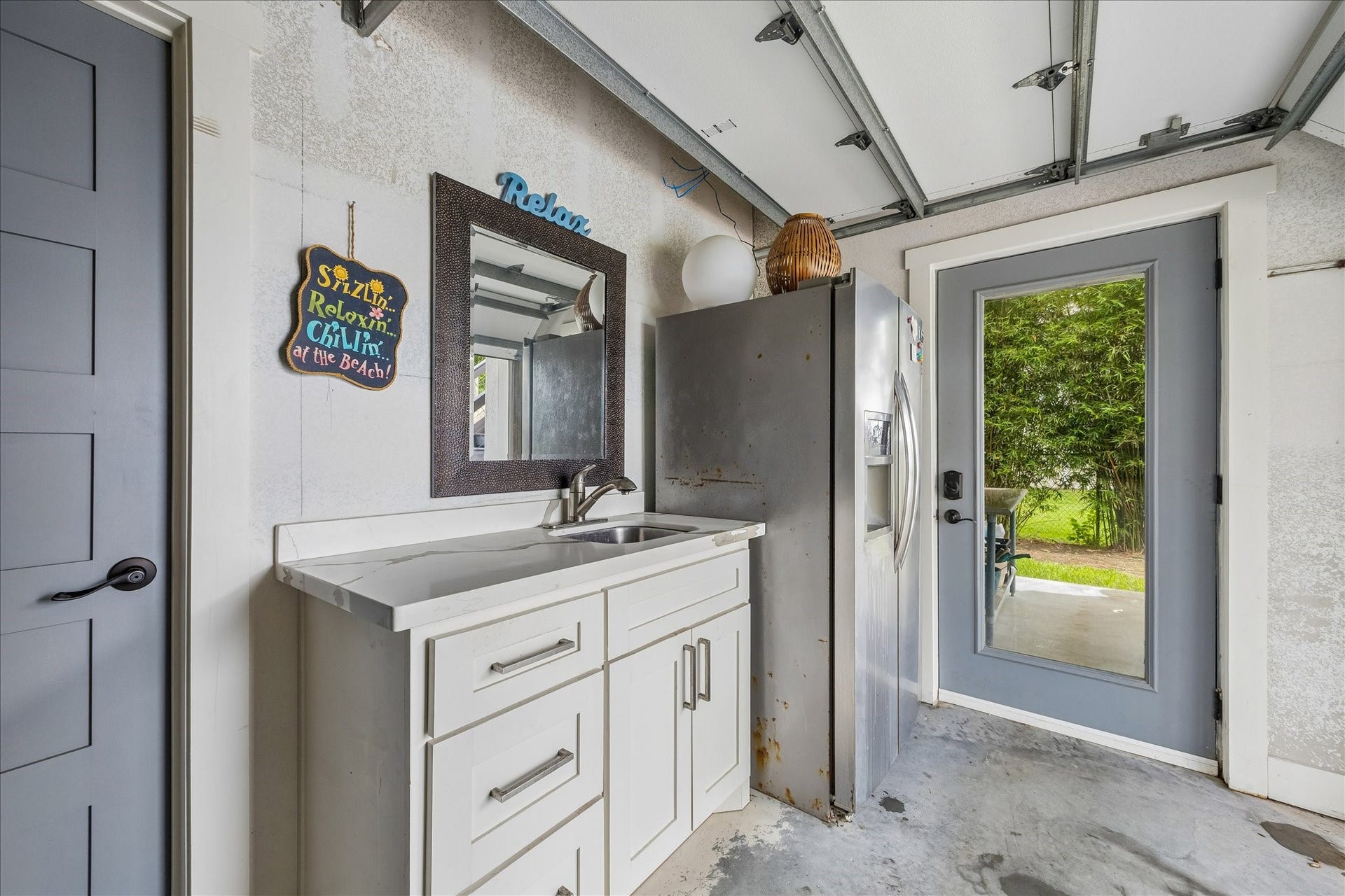 4019 Bayshore Drive Drive, Bacliff, TX 77518 Pool bath, sink and full refrigerator in garage