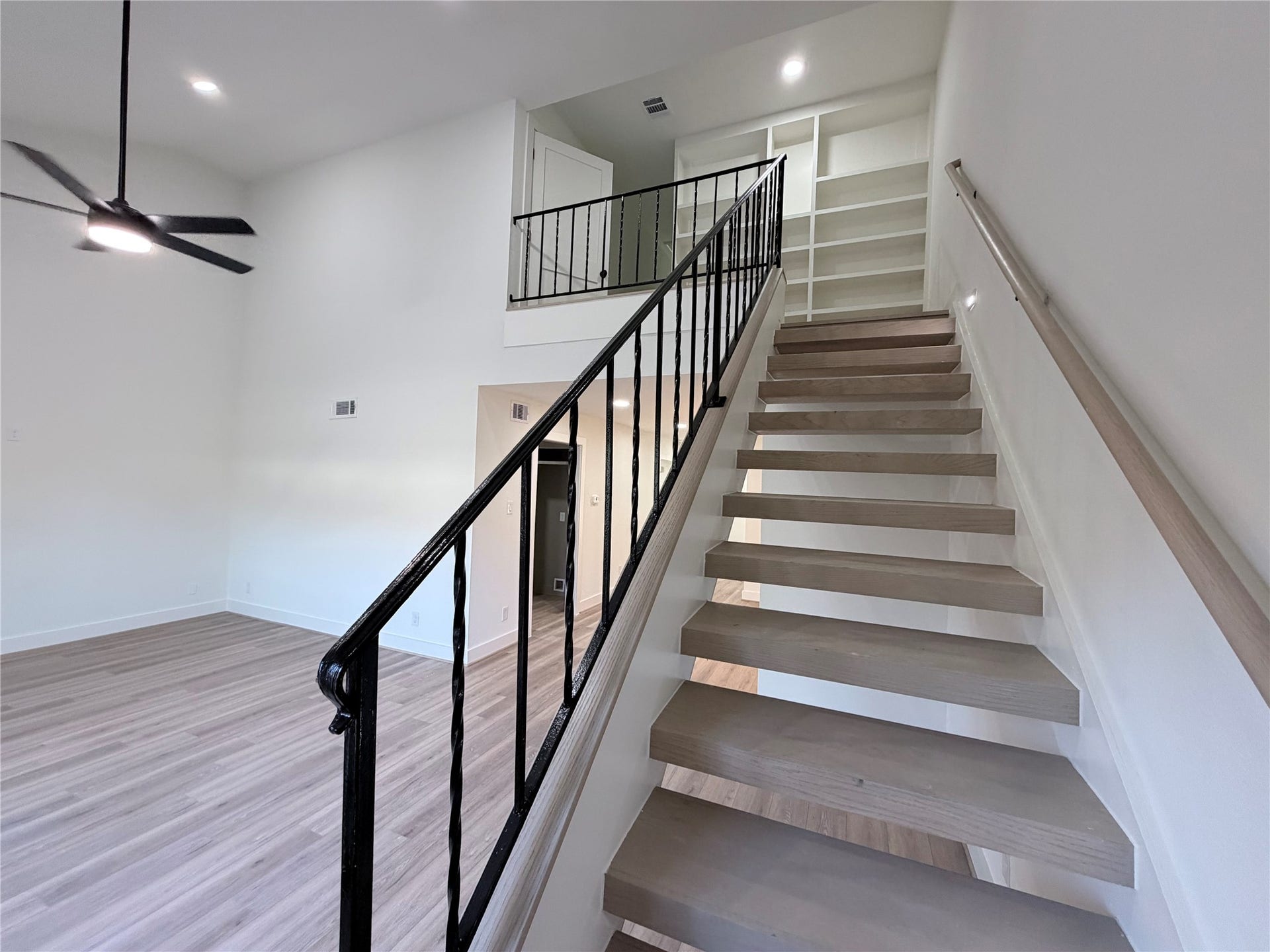 14309 Misty Meadows Lane, Houston, TX 77079 Stairs have been reimagined to be modern, open and a raised stair rail for extra security.