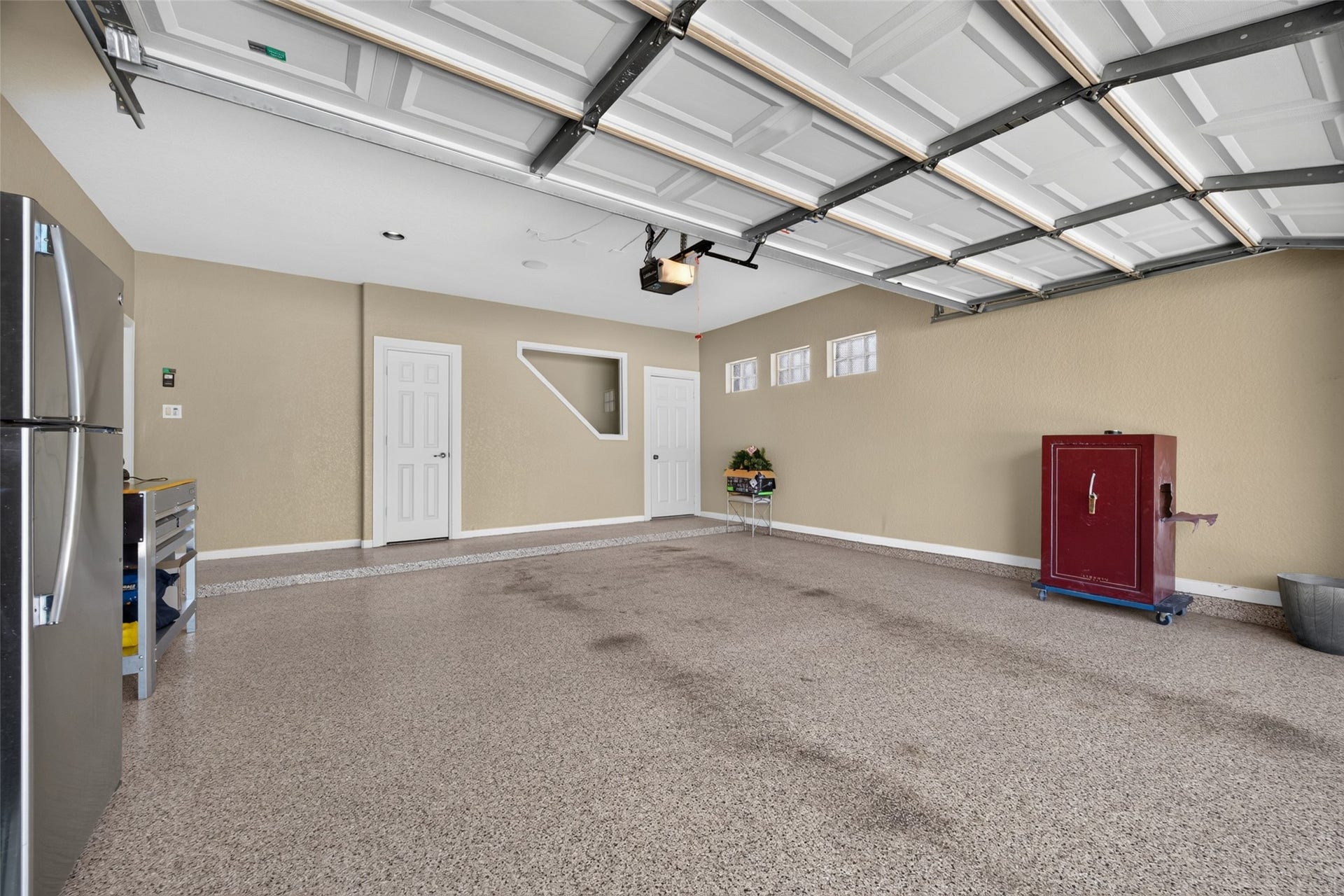 1811 Arbor Forest Trail, Houston, TX 77345 Garage with stairs to attic