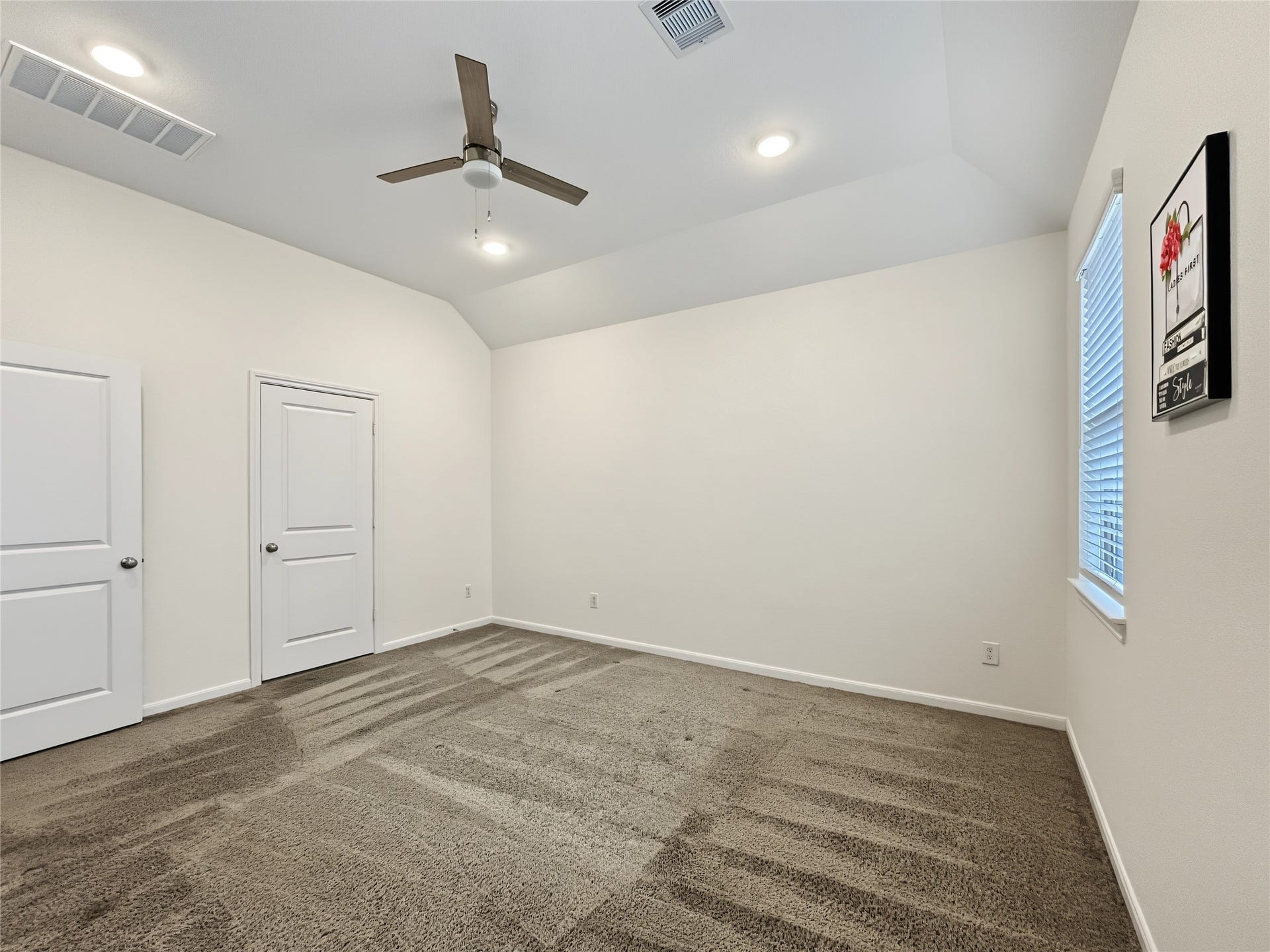 Nice view of the spacious primary bedroom.
