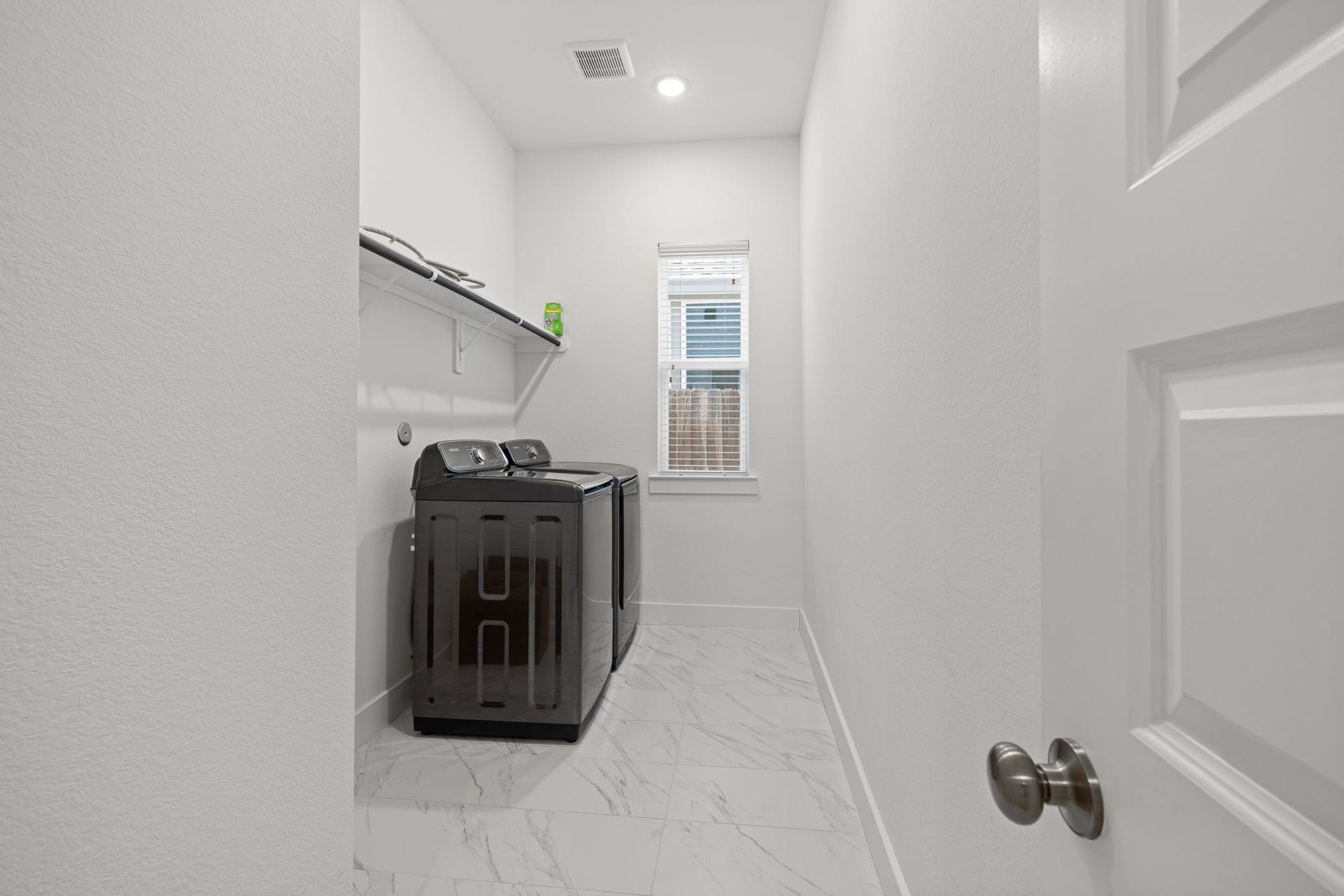 9211 Fury Landing Lane, Tomball, TX 77375 Washer and dryer stay in this spacious and functional laundry room