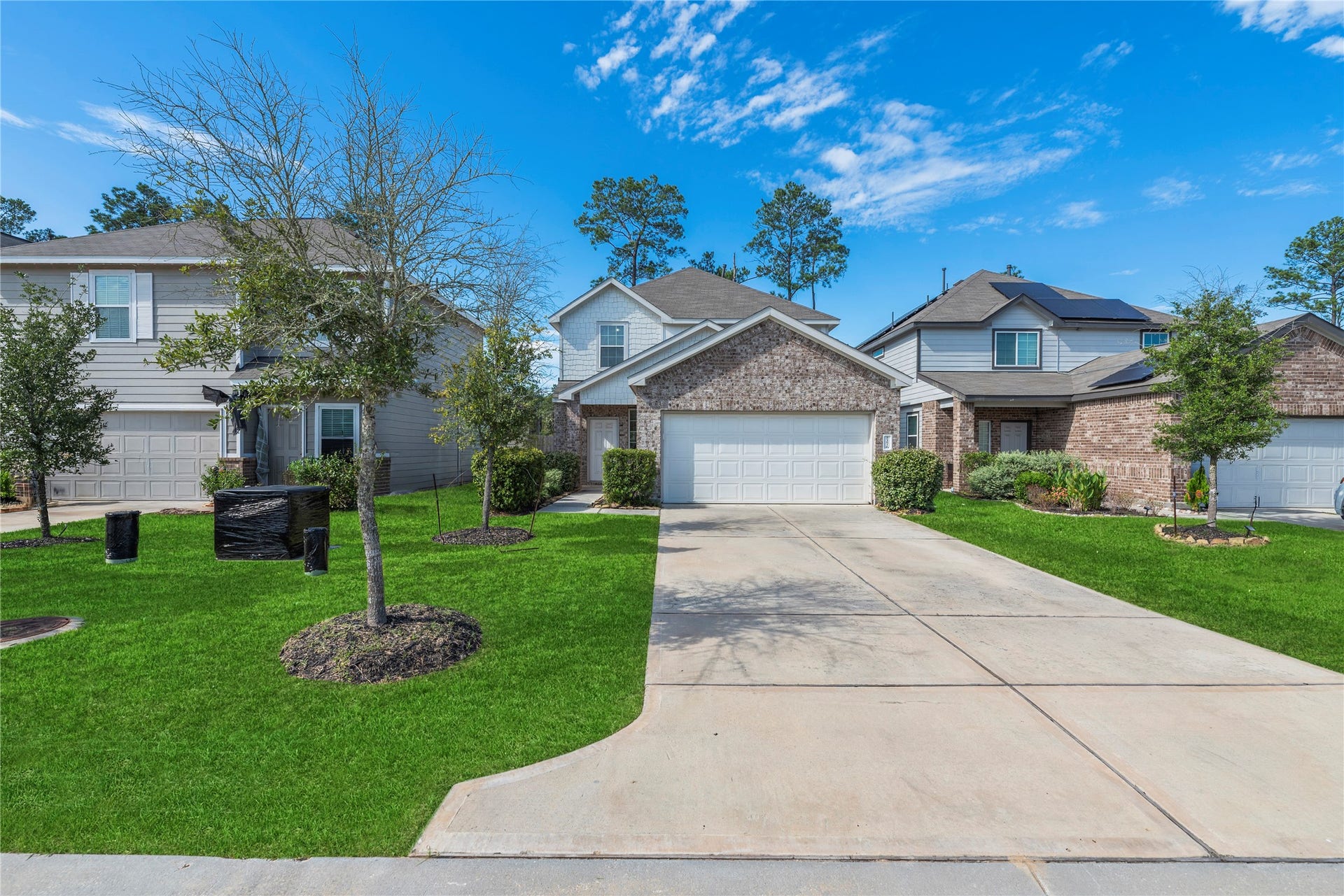 2276 Raider Drive, Conroe, TX 77301 Inviting front elevation and landscaped approach