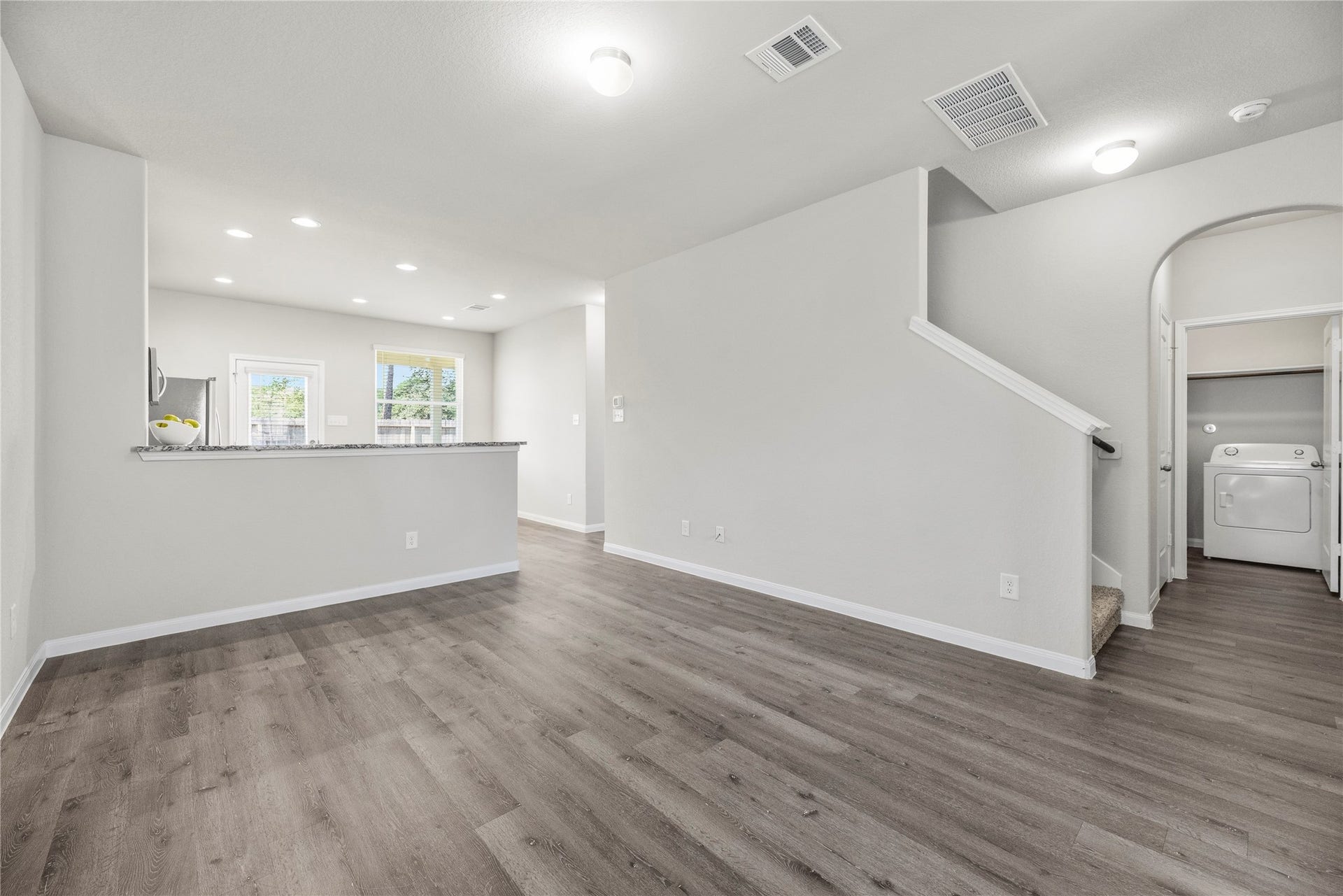 2276 Raider Drive, Conroe, TX 77301 Open living, dining, kitchen layout.