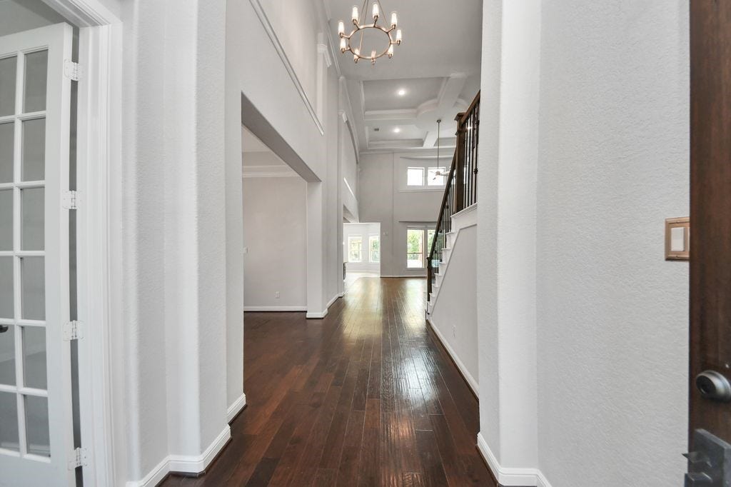 4035 Ashland Woods Drive, Spring, TX 77386 2 story entry with tray ceiling & a chandelier.