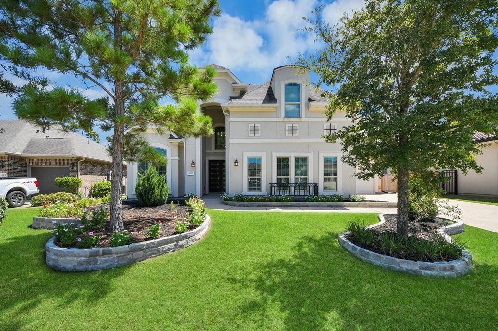 4035 Ashland Woods Drive, Spring, TX 77386 Notice the extensive stone landscape pavers, & lovely front elevation.