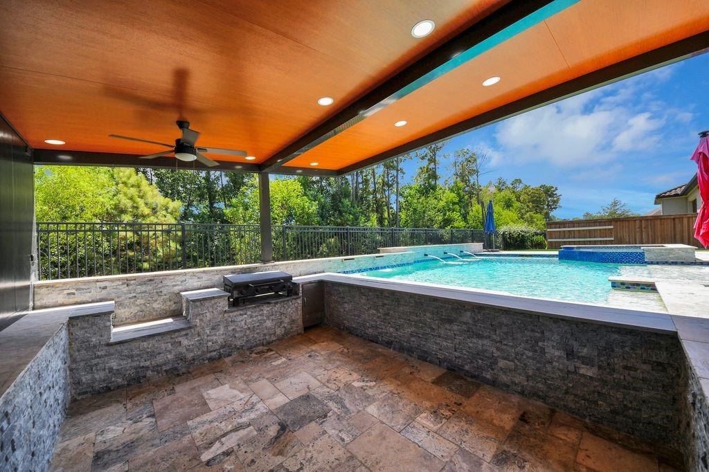 4035 Ashland Woods Drive, Spring, TX 77386 Extensive stonework adorns this covered area with views of the greenbelt!