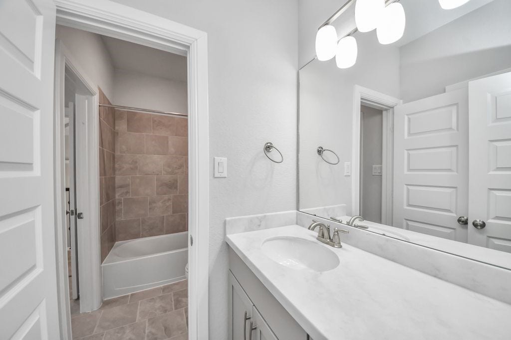 4035 Ashland Woods Drive, Spring, TX 77386 Third full bathroom with double vanities & double sinks.