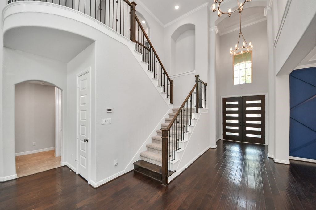 4035 Ashland Woods Drive, Spring, TX 77386 Wrought iron railings adorn this staircase.