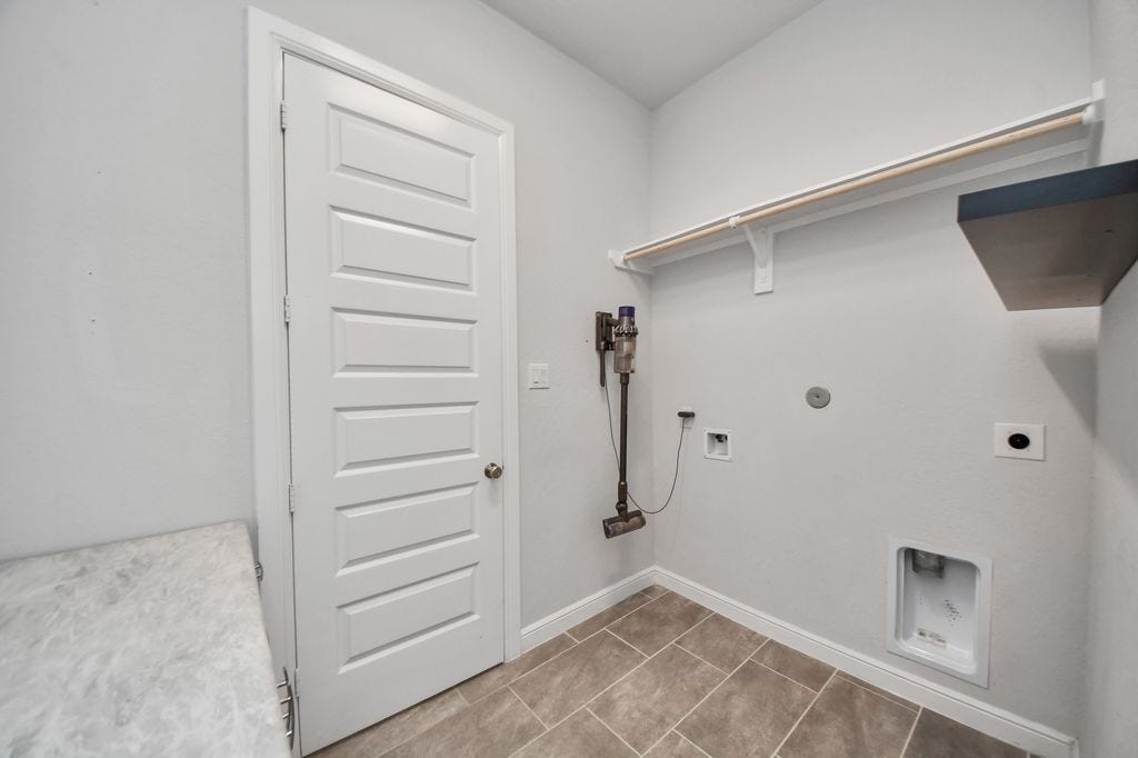 4035 Ashland Woods Drive, Spring, TX 77386 Large utility room with a folding shelf & room for a refrigerator. (fridge is included!)