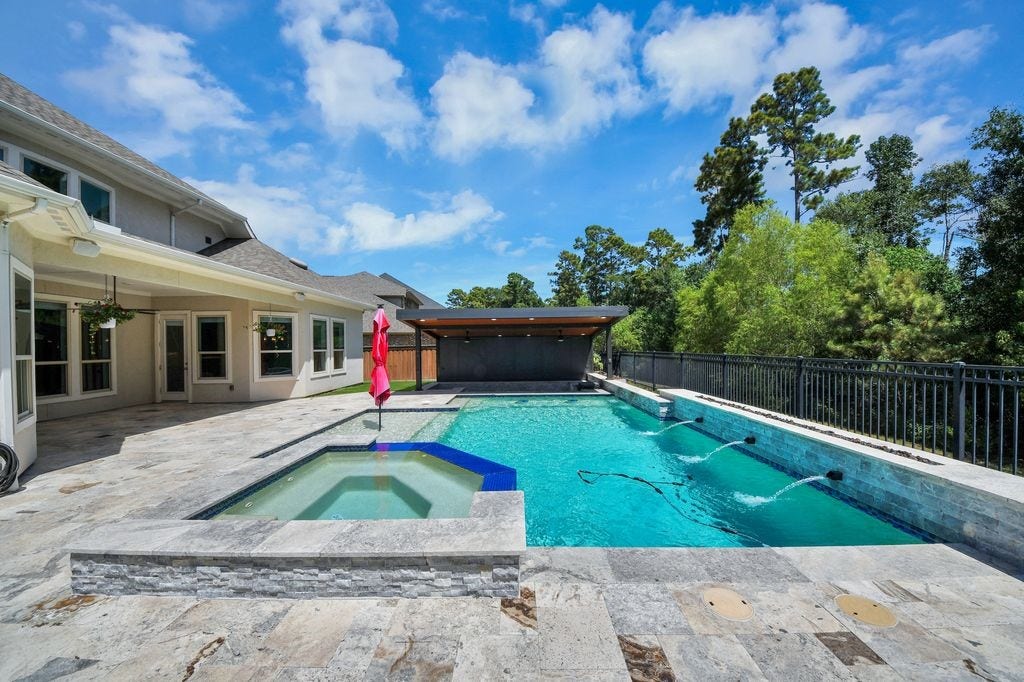 4035 Ashland Woods Drive, Spring, TX 77386 Pool & spa with fire pit feature, waterfall & tanning shelf.