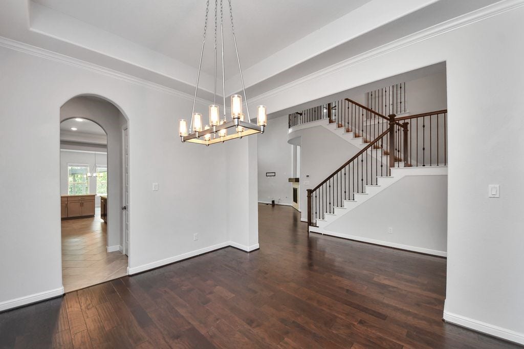 4035 Ashland Woods Drive, Spring, TX 77386 View from the formal dining room into the stairway area and entrance to the butler's pantry & kitchen.