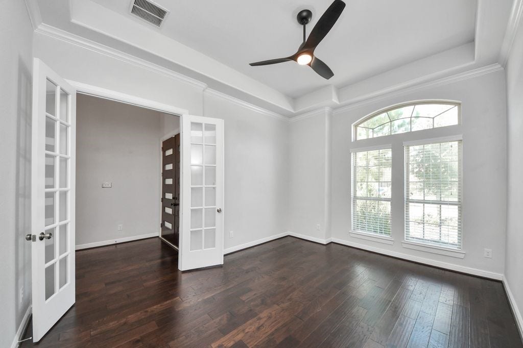 4035 Ashland Woods Drive, Spring, TX 77386 Formal study with French doors and designer ceiling fan.