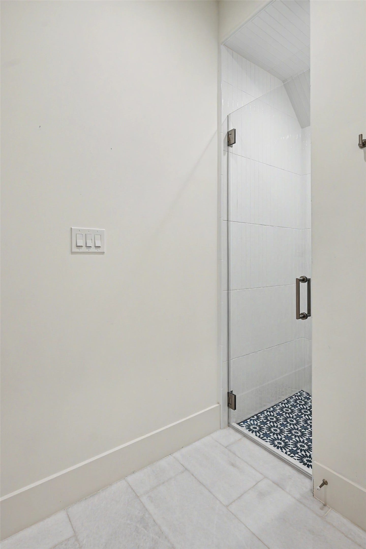1605 Mcduffie Street, Houston, TX 77019 A tiled shower nook completes the secondary bath with a tailored blend of form and function.
