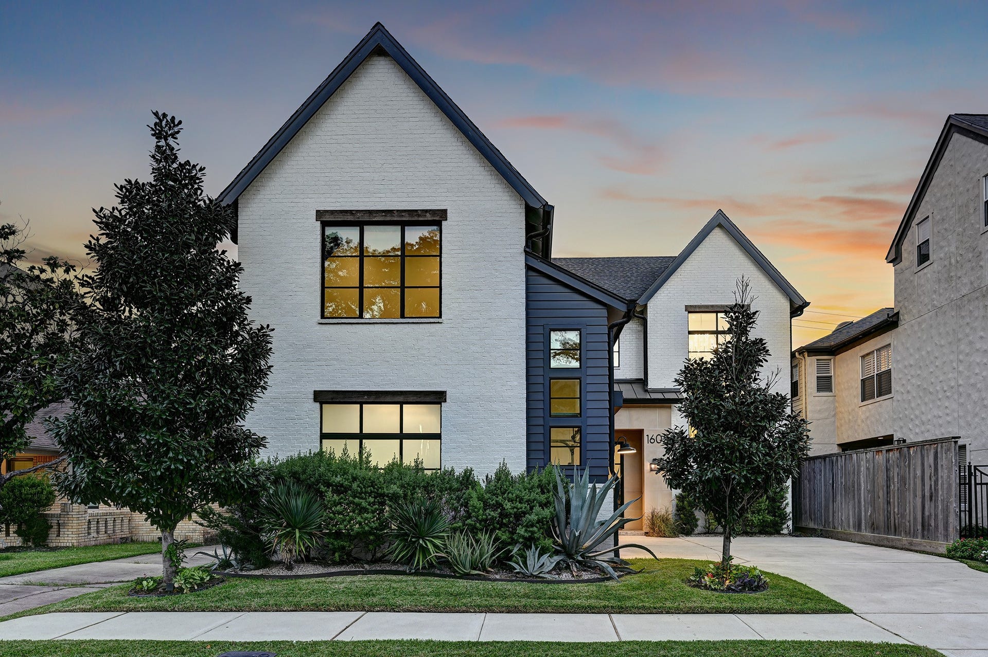 1605 Mcduffie Street, Houston, TX 77019 A final exterior view highlights the homes distinctive rooflines, contrasting materials and inviting architectural presence.