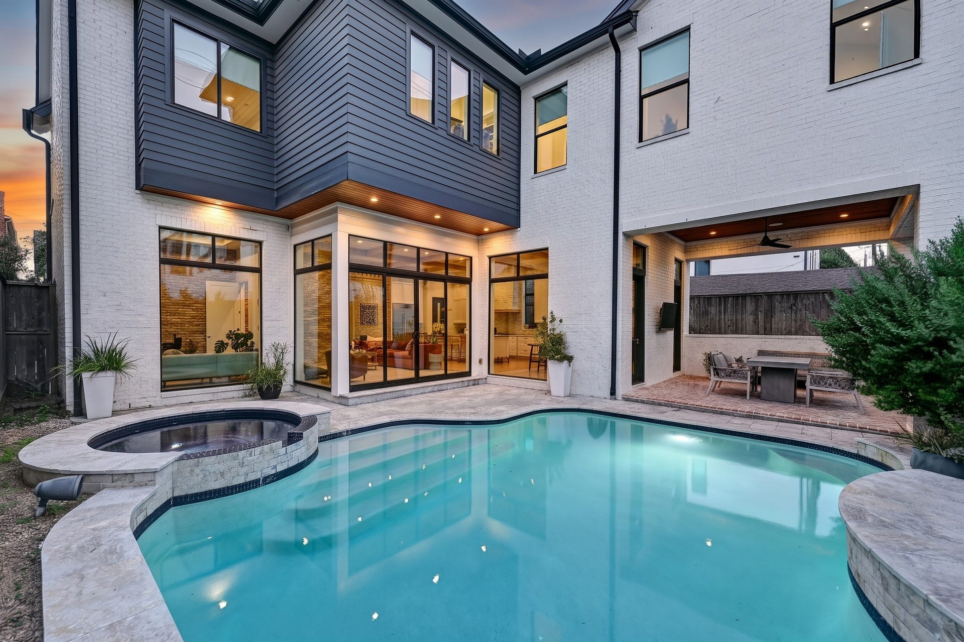 1605 Mcduffie Street, Houston, TX 77019 The heated pool and attached spa create a private outdoor retreat framed by the homes striking architecture.