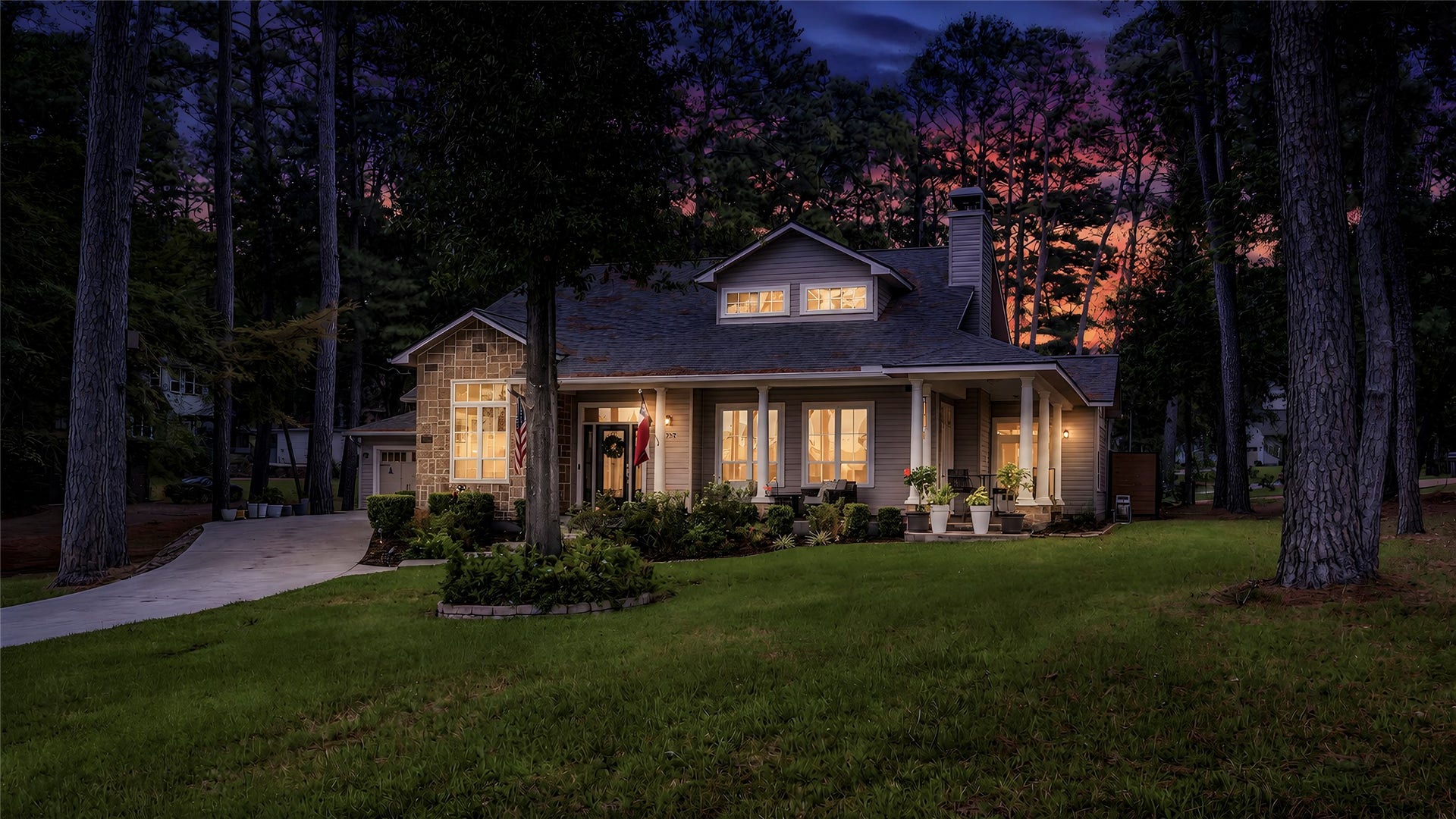 Front and side porch create the perfect sitting area with lake views of Lake Conroe.