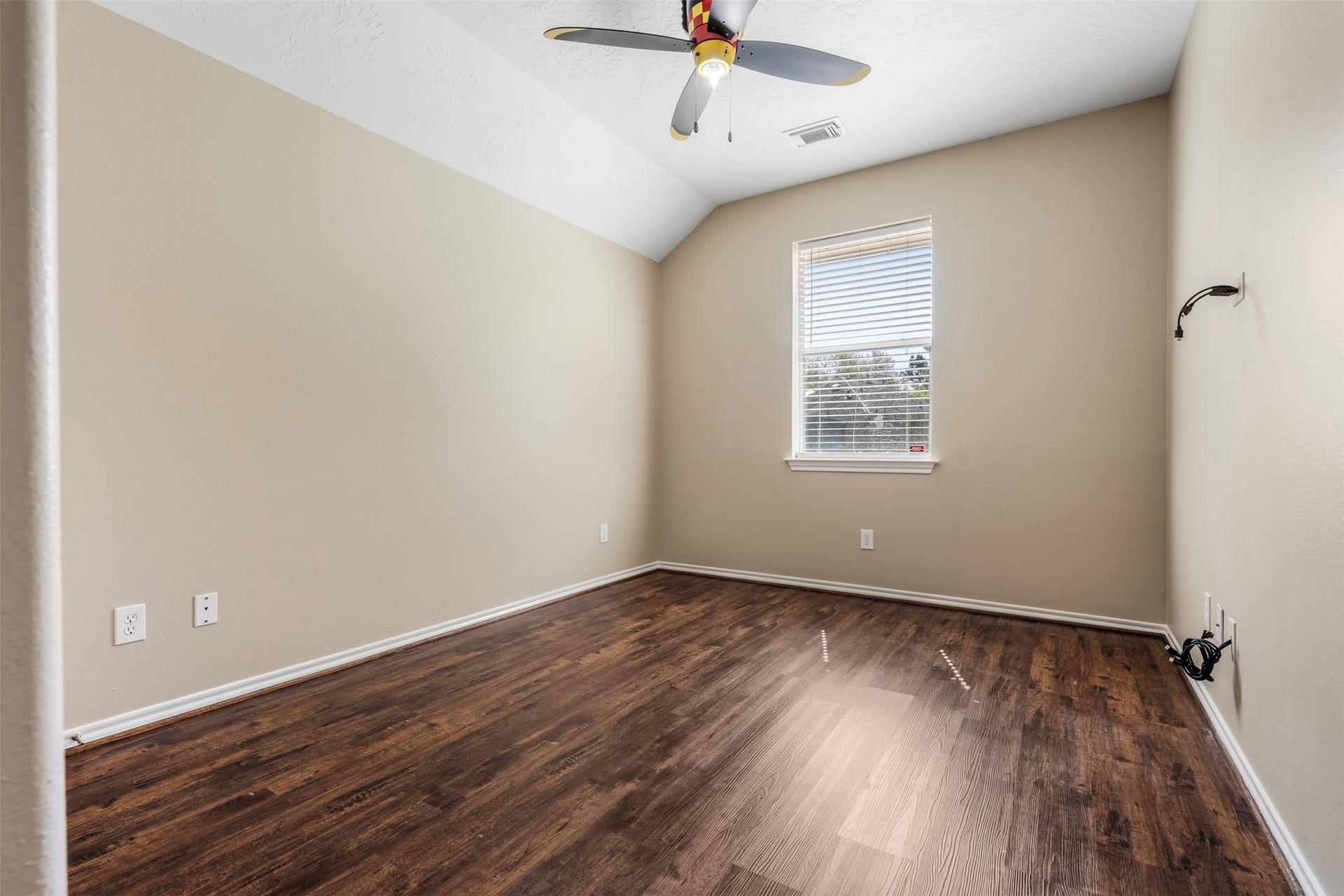 12902 Cascadia Knoll Court, Humble, TX 77346 3rd bedroom featuring a ceiling fan, and a window overlooking the backyard.