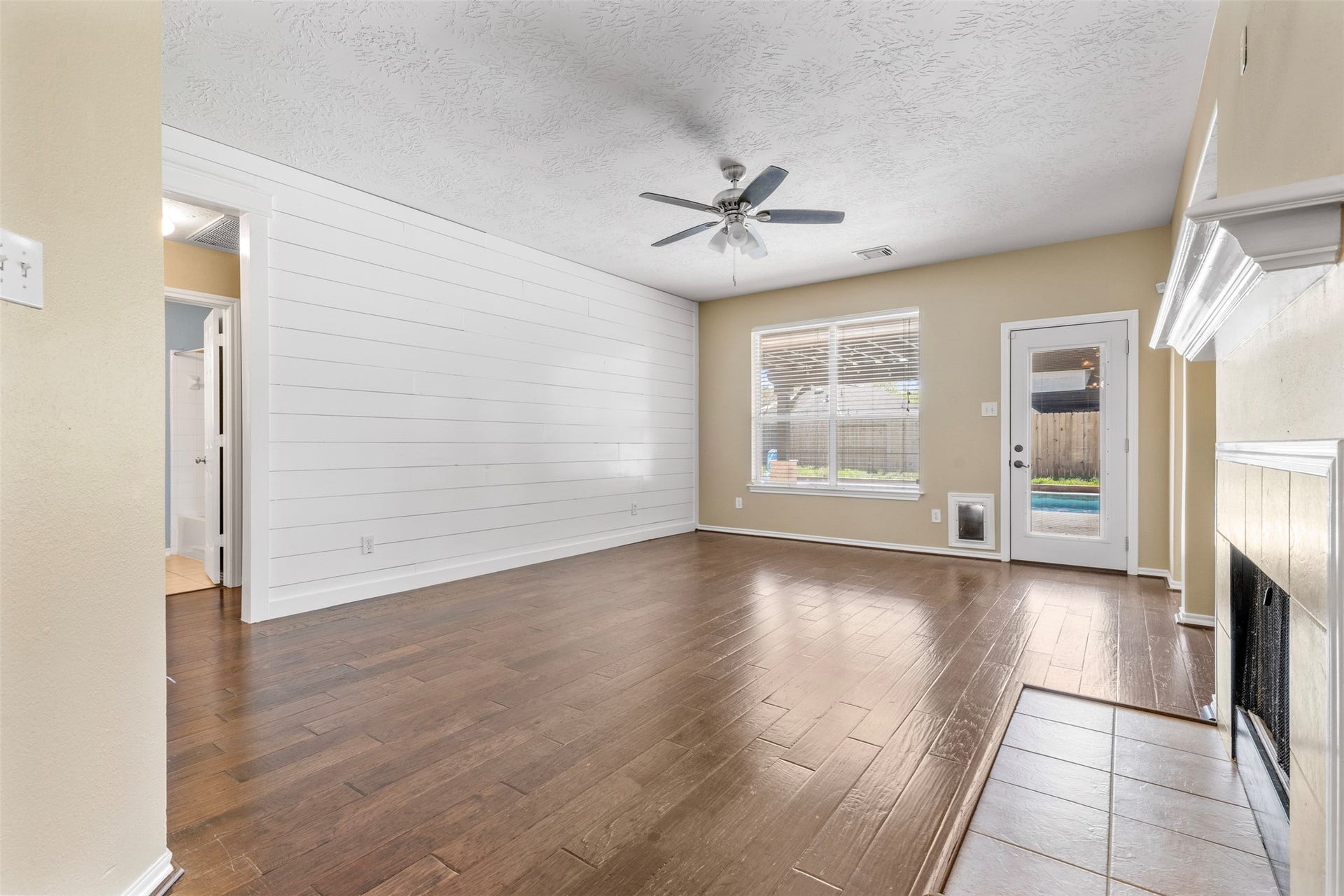 12902 Cascadia Knoll Court, Humble, TX 77346 Spacious living area with windows providing natural light.