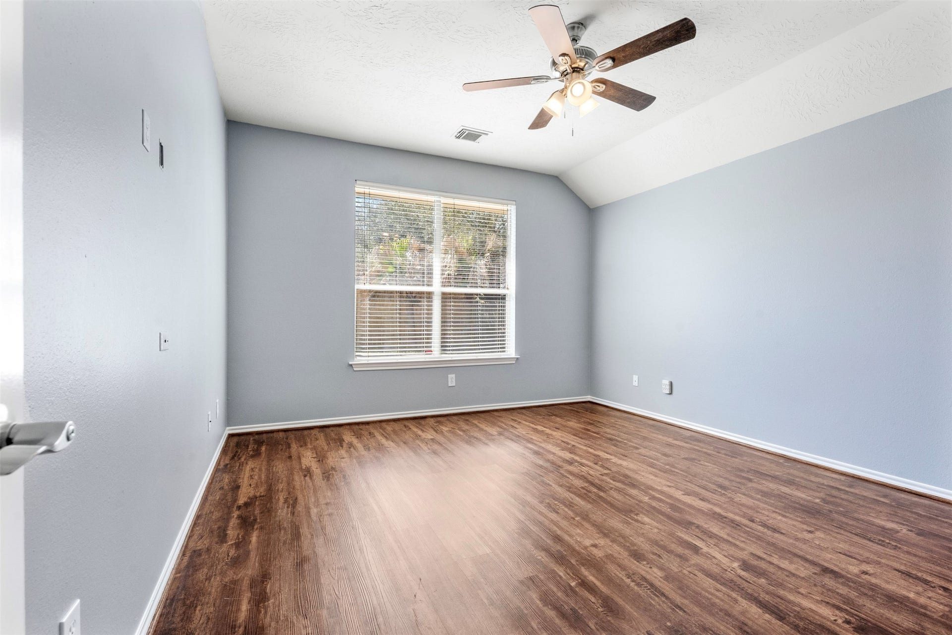 12902 Cascadia Knoll Court, Humble, TX 77346 Primary bedroom offers a simple layout with ample space.