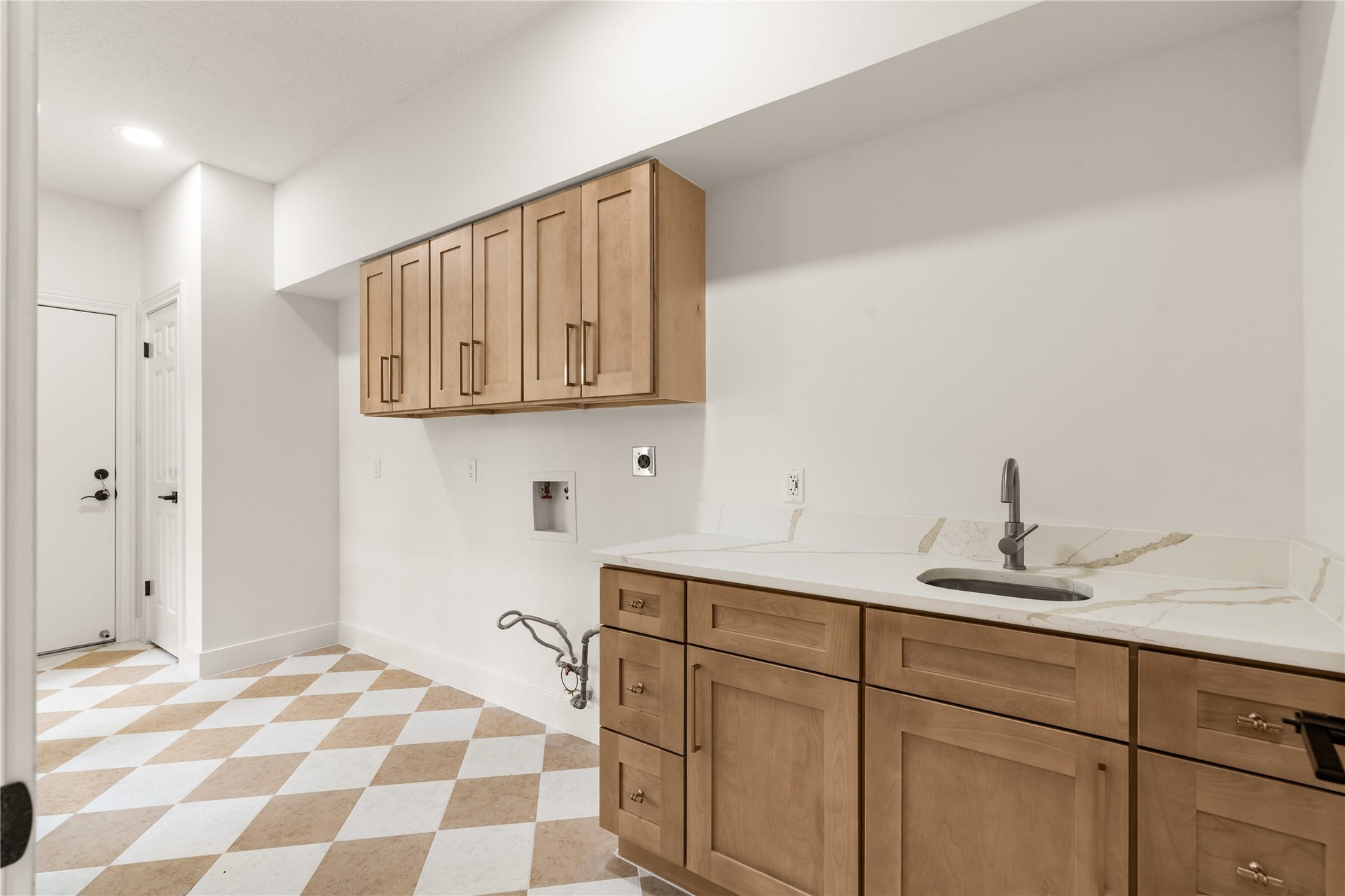 618 Rock Cove, Houston, TX 77079 Laundry Room with cabinets and sink