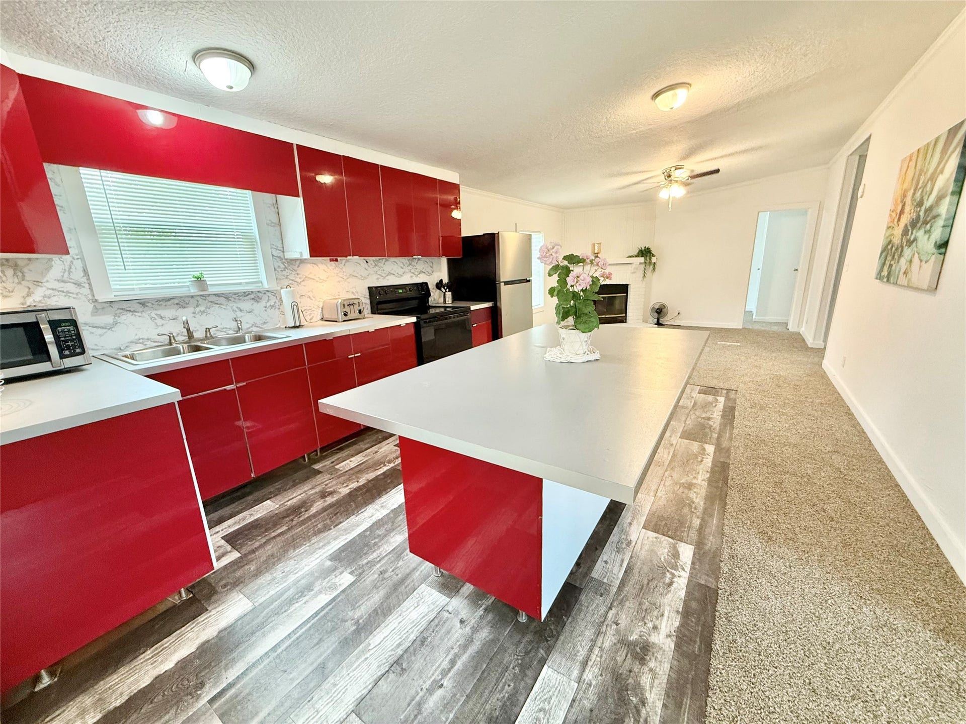 237 Linda Lane, Oyster Creek, TX 77541 Beautiful kitchen open to family room with a cozy fireplace