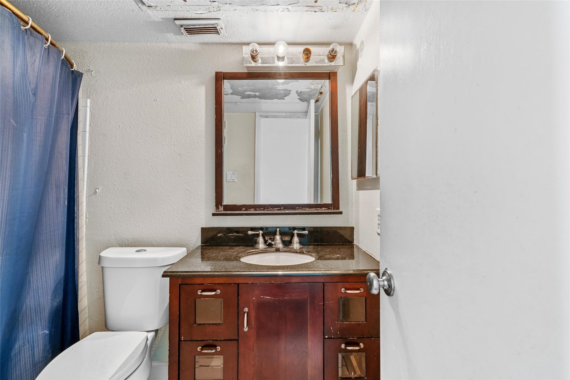 3900 Woodchase Drive, #162, Houston, TX 77042 Full bathroom features a vanity area with mirror and practical layout for everyday use.