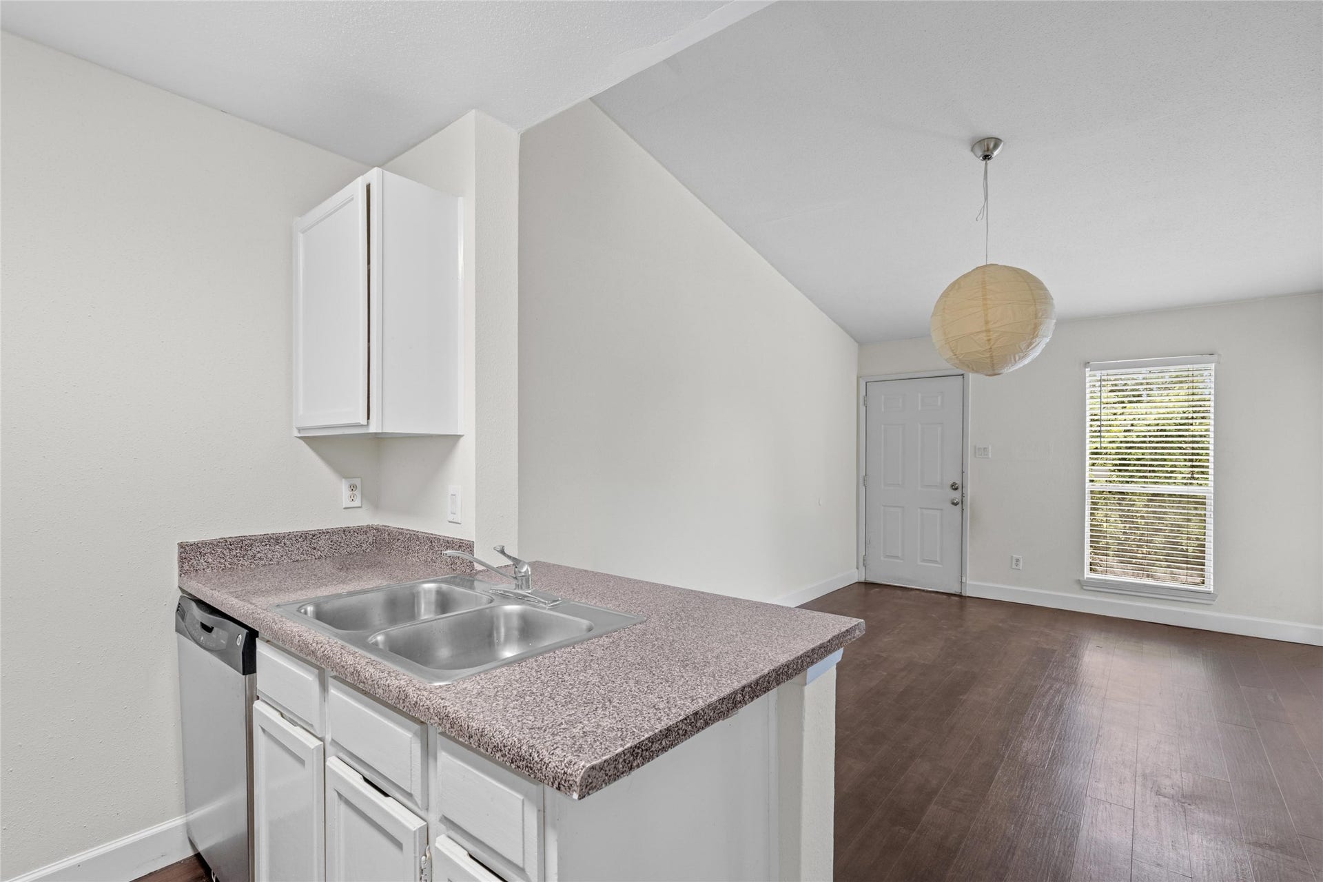 3900 Woodchase Drive, #162, Houston, TX 77042 Open view from the kitchen showcases its connection to the adjoining living area and overall functional layout.