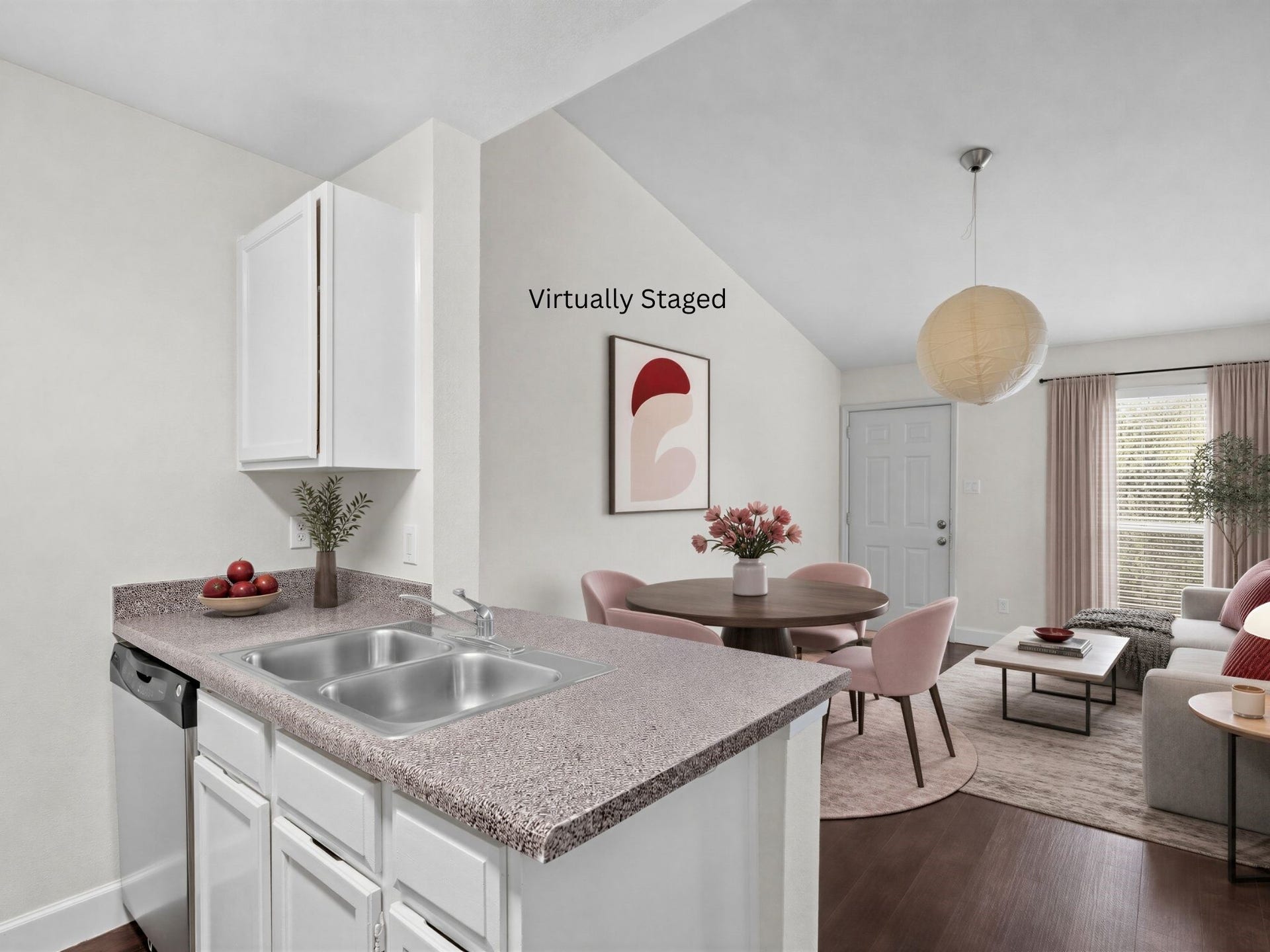 3900 Woodchase Drive, #162, Houston, TX 77042 Virtually staged for visualization purposes only; furnishings are not included. Open sightlines connect the kitchen with the adjoining dining and living areas.