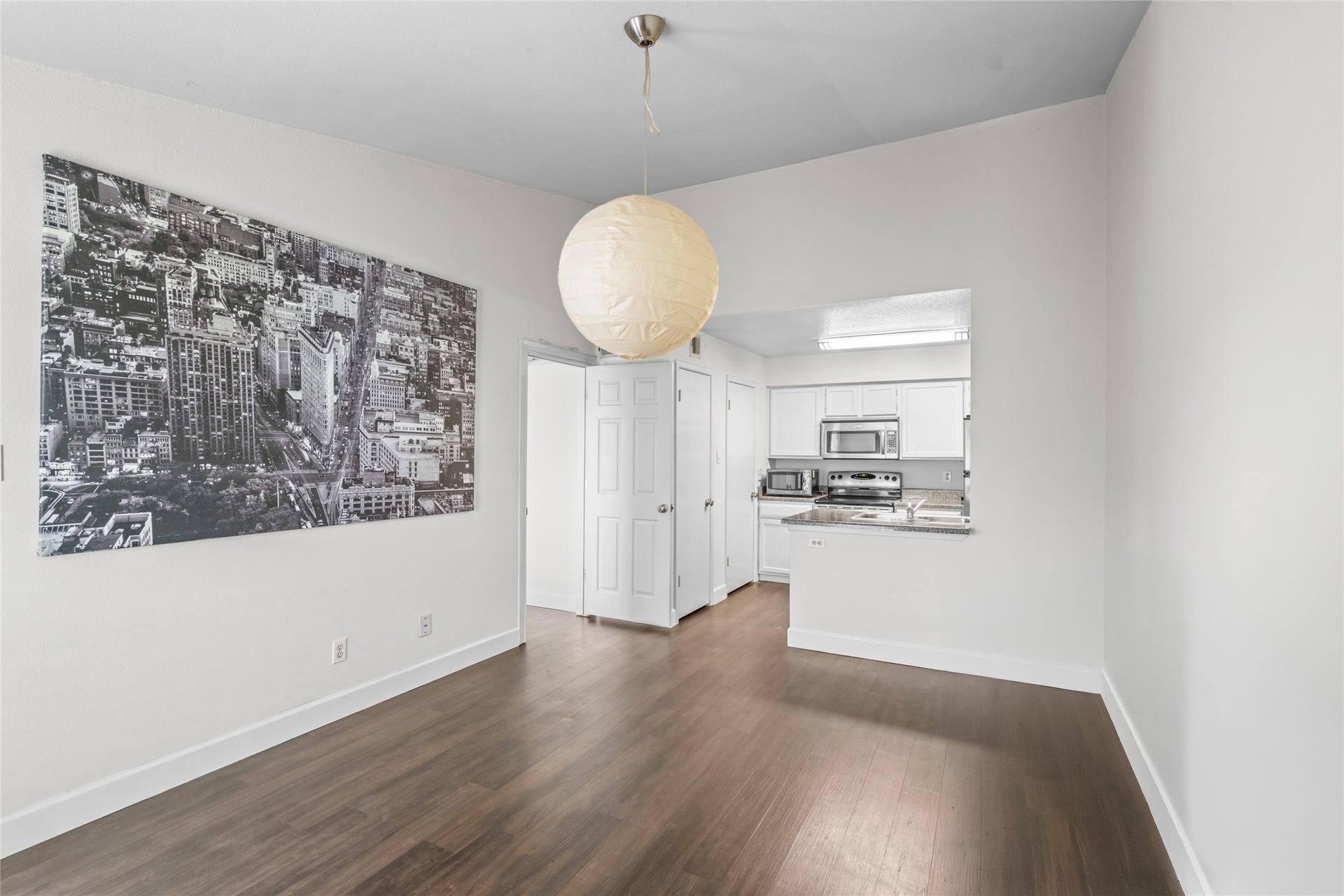 3900 Woodchase Drive, #162, Houston, TX 77042 Open living and dining area provides versatile space for everyday living, entertaining, or creating a layout tailored to the new owner's needs.