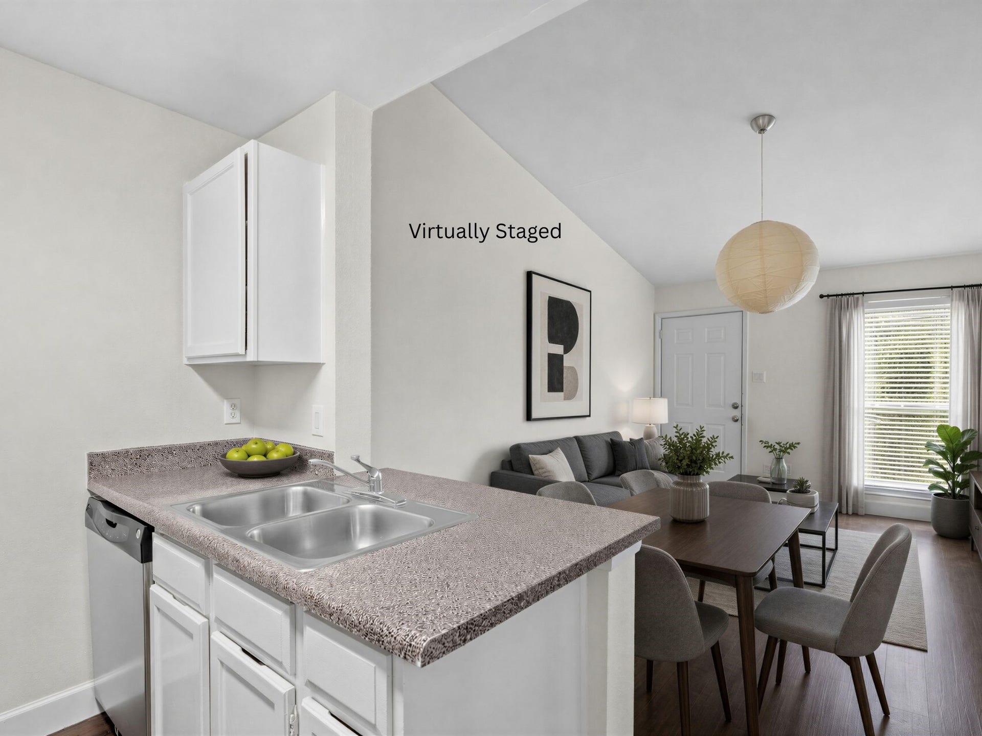 3900 Woodchase Drive, #162, Houston, TX 77042 Virtually staged for visualization purposes only; furnishings are not included. Kitchen opens toward the dining area, creating an efficient and connected living space.