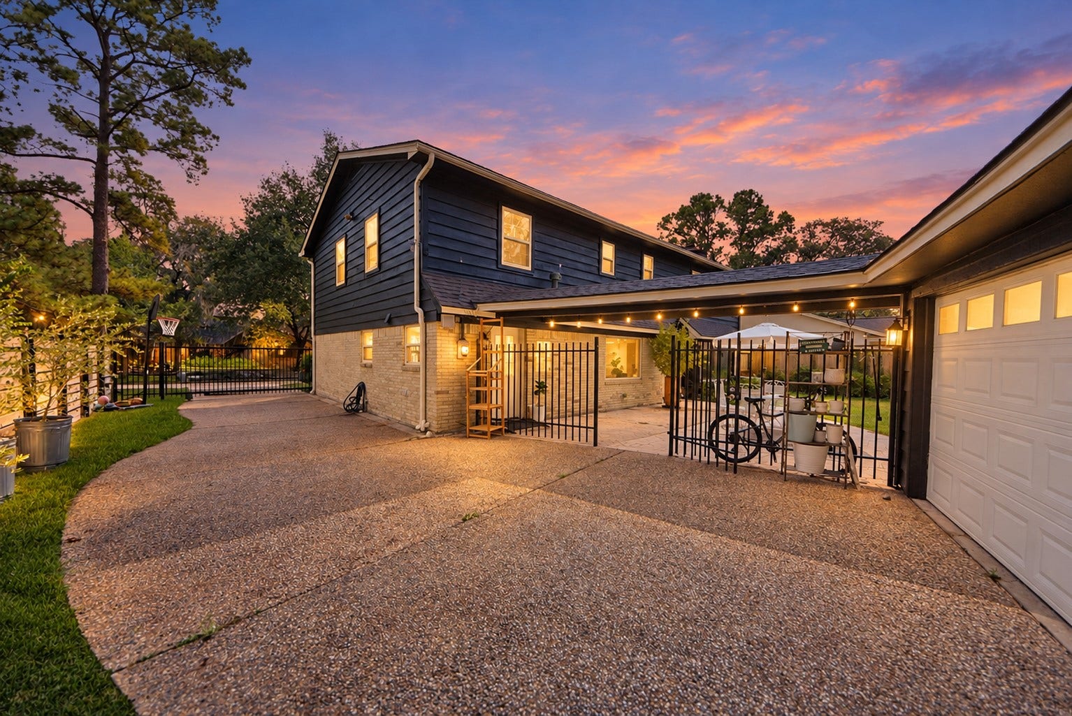 12574 Westerley Lane, Houston, TX 77077 A sweeping lawn, mature trees, and a curved patio create an inviting backyard setting for outdoor dining, play, and relaxed evenings.